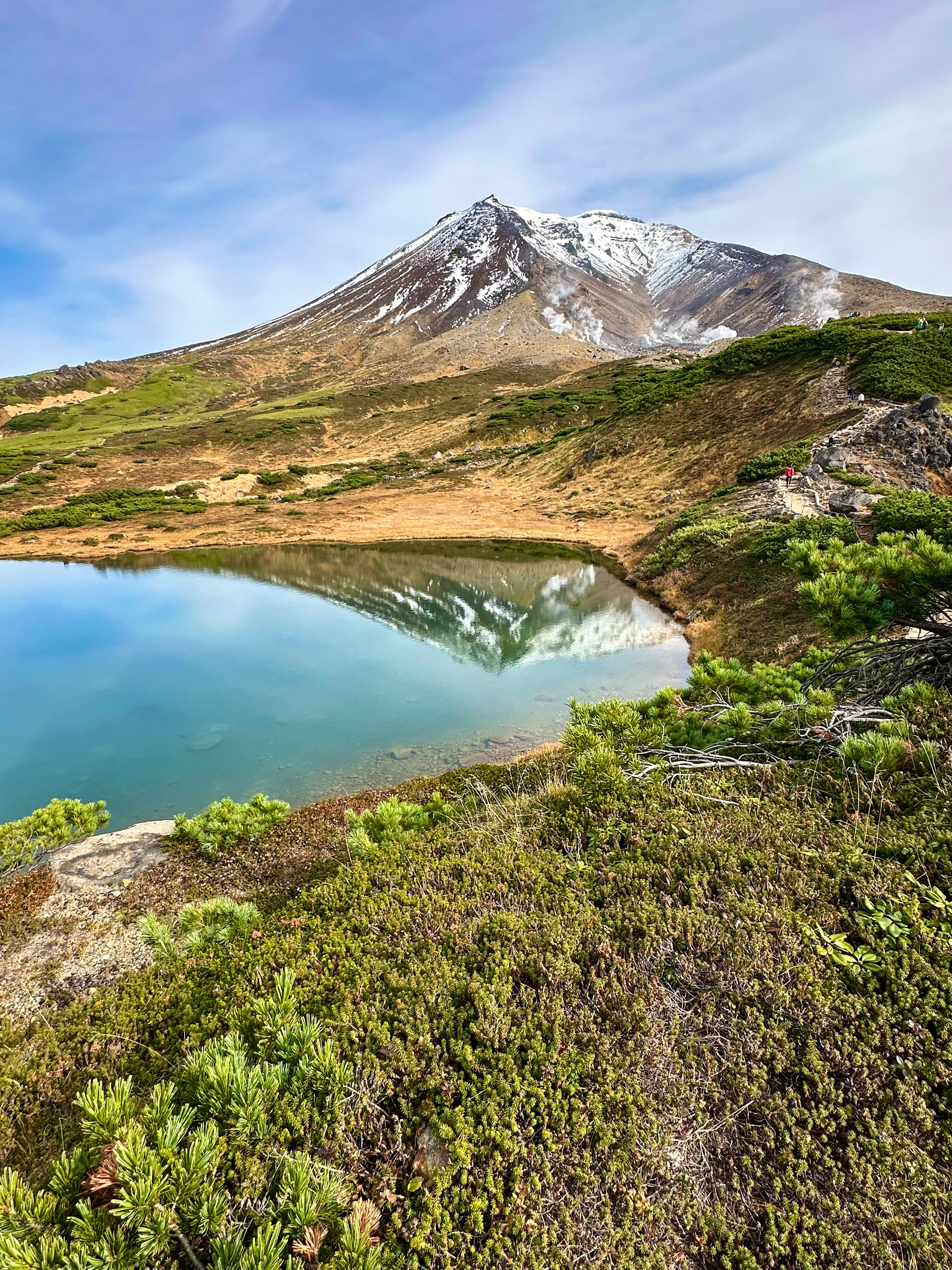 Scenic view of a snow-capped mountain reflected in a tranquil lake