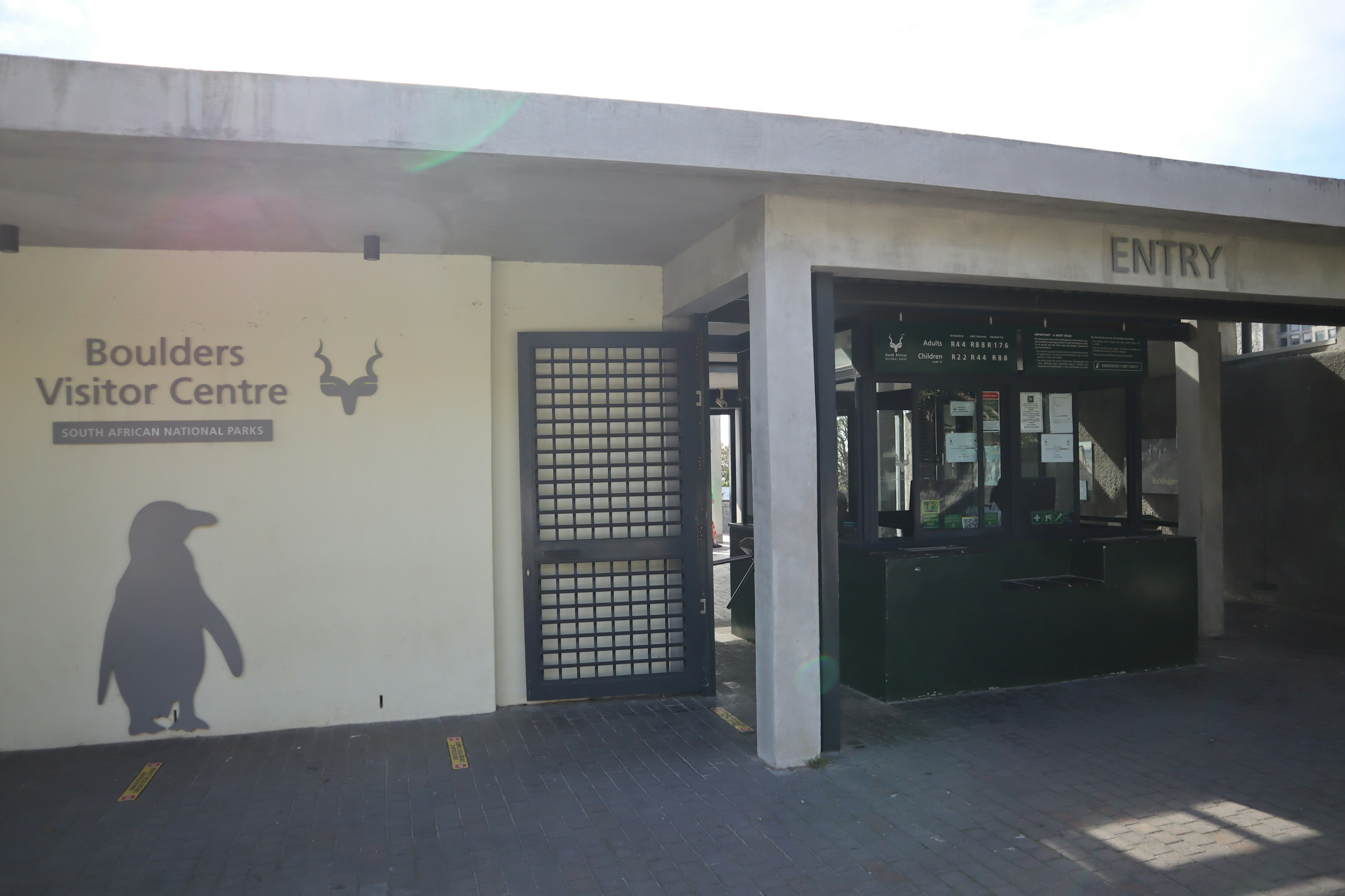 Exterior view of Boulders Visitor Center featuring a penguin shadow