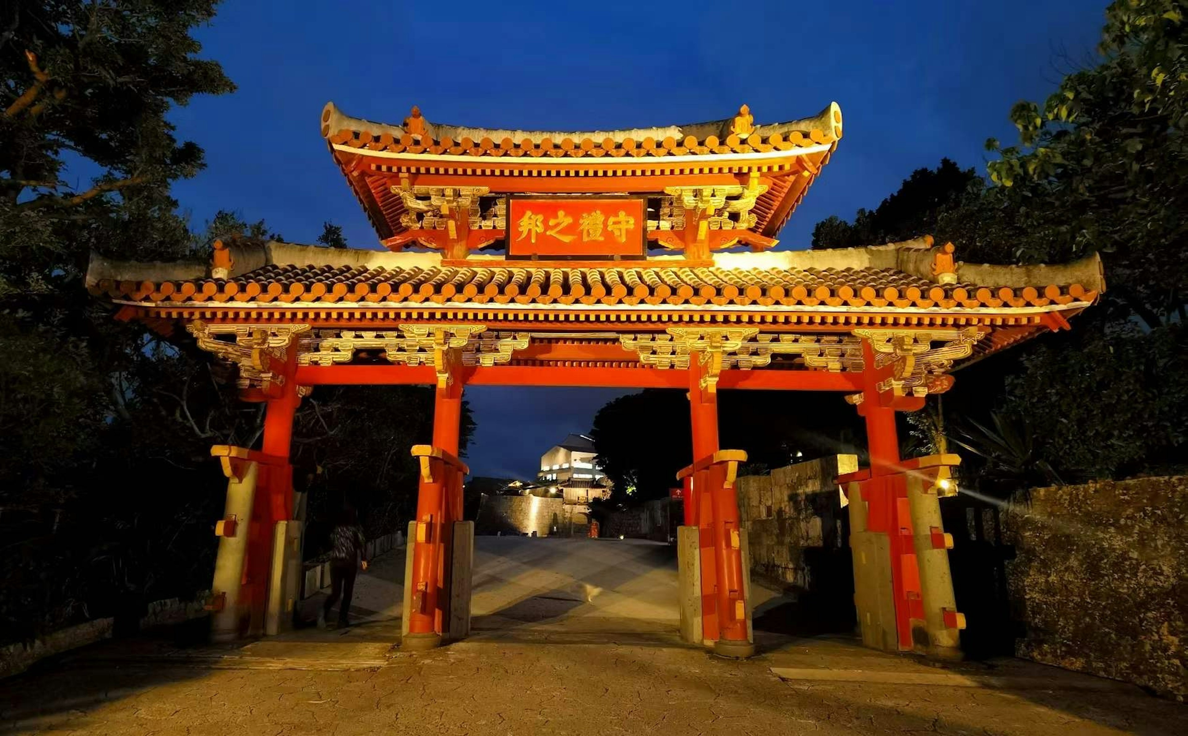 A beautiful red gate glowing in the tranquility of night