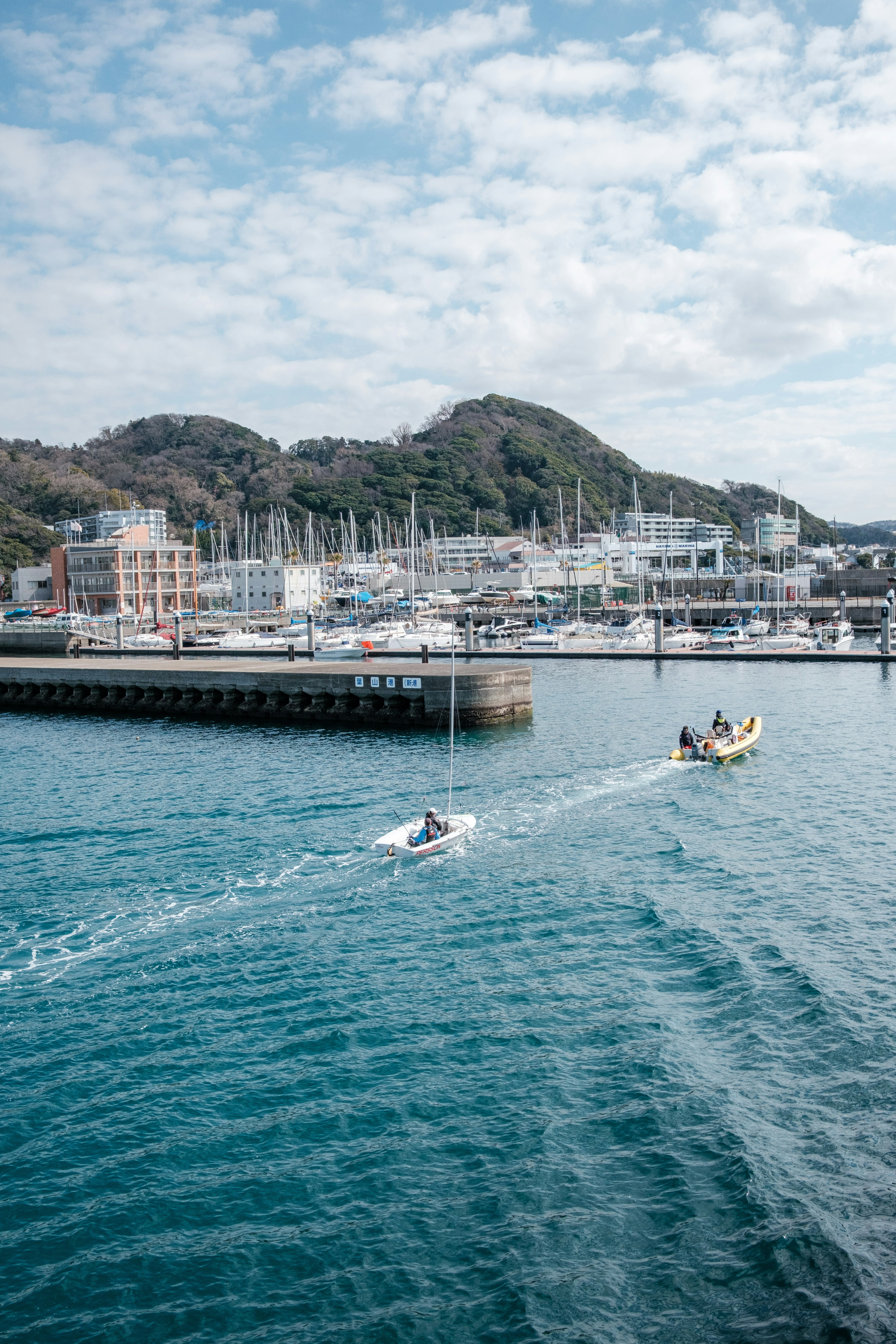 Scenic view of a harbor with blue water and boats moored