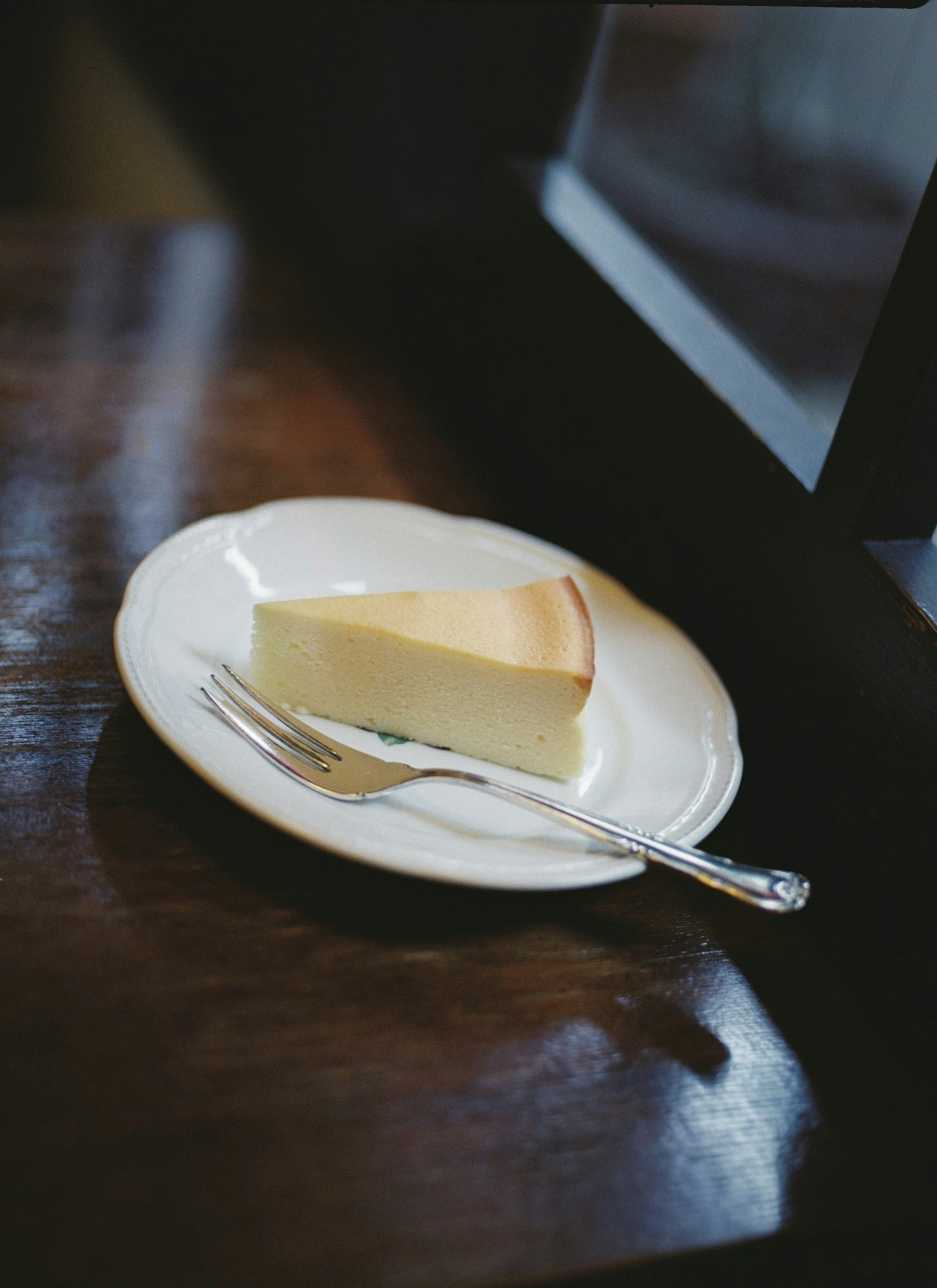 Slice of creamy cheesecake on a beautiful plate