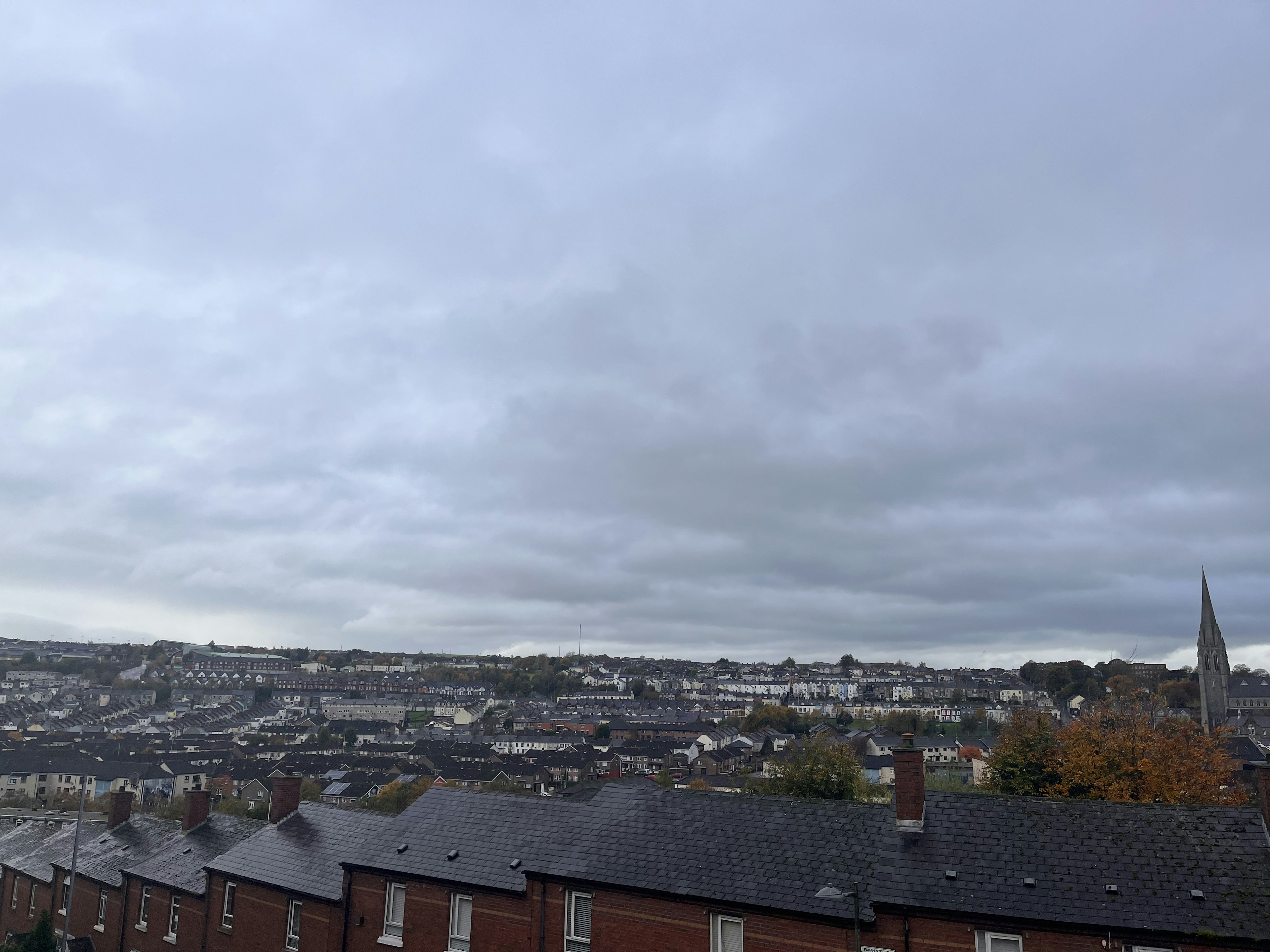 View of a residential area under a cloudy sky