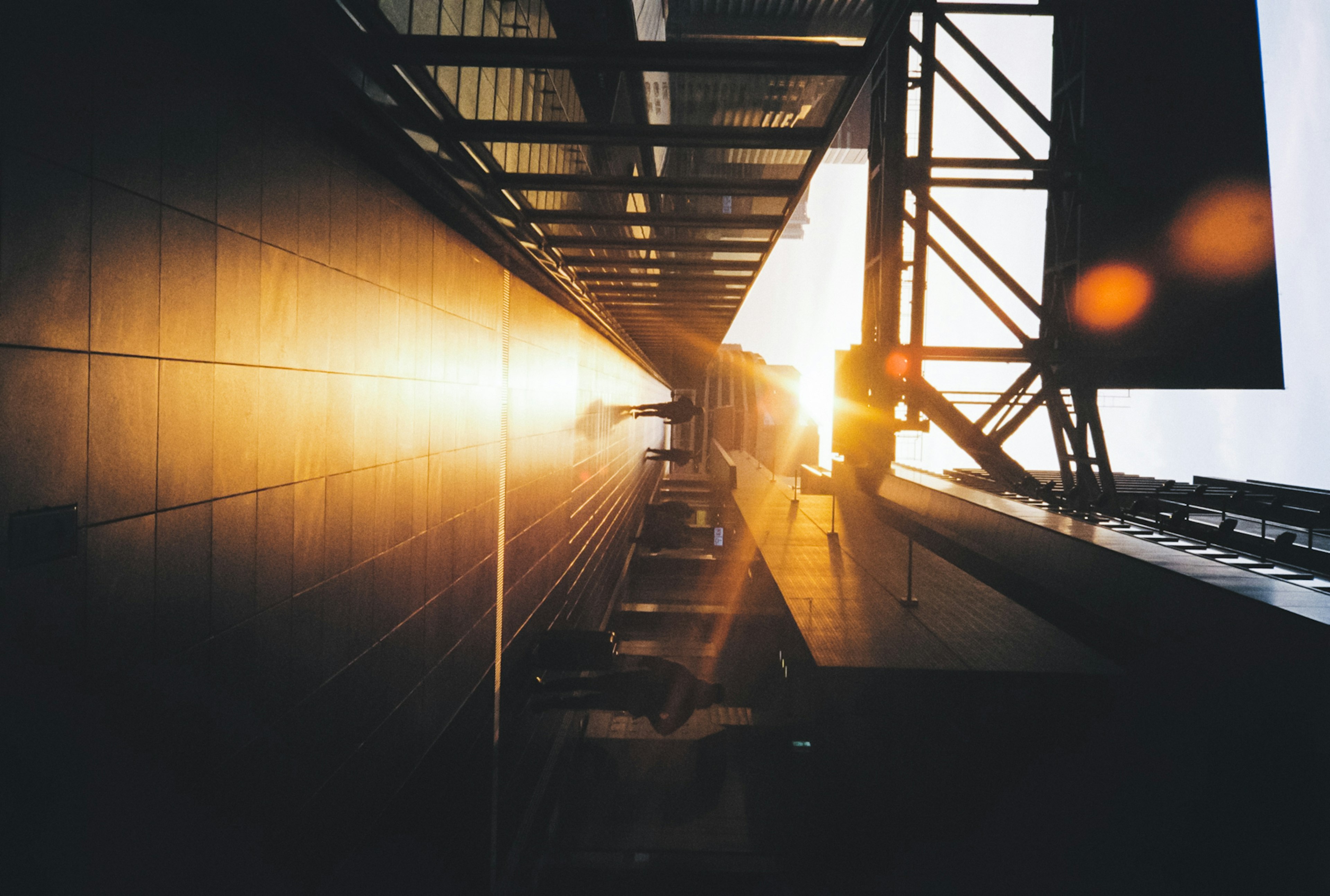 Sunlight reflecting on a building's wall and structural elements