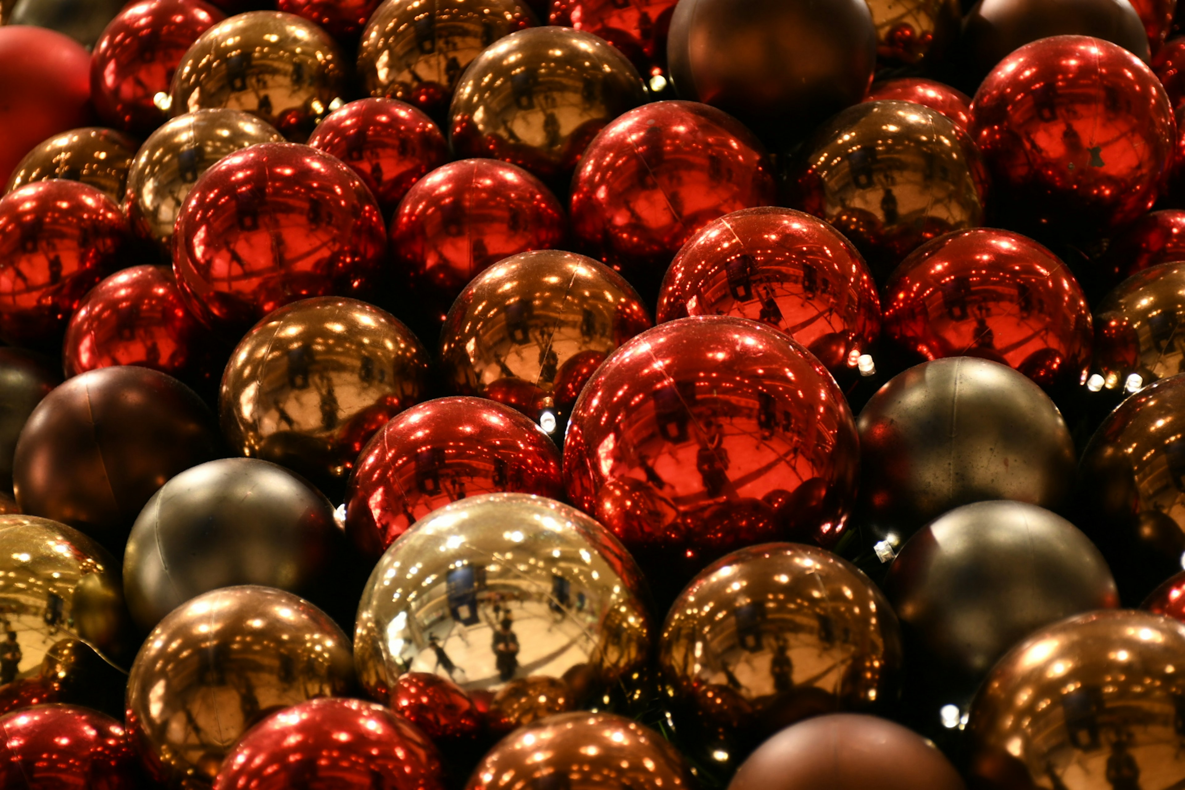 Close-up image of red and gold Christmas ornaments