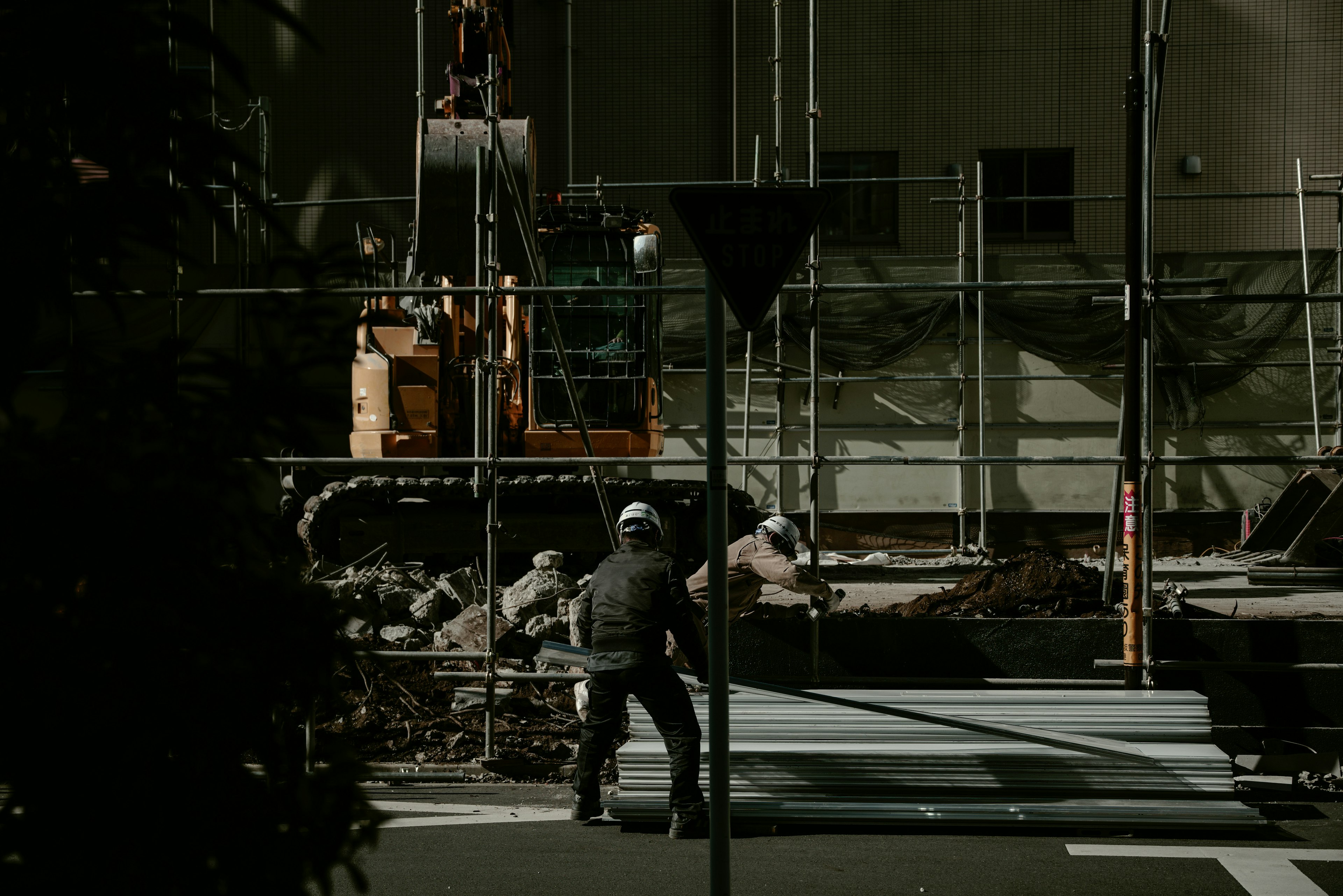 Construction site with workers and heavy machinery