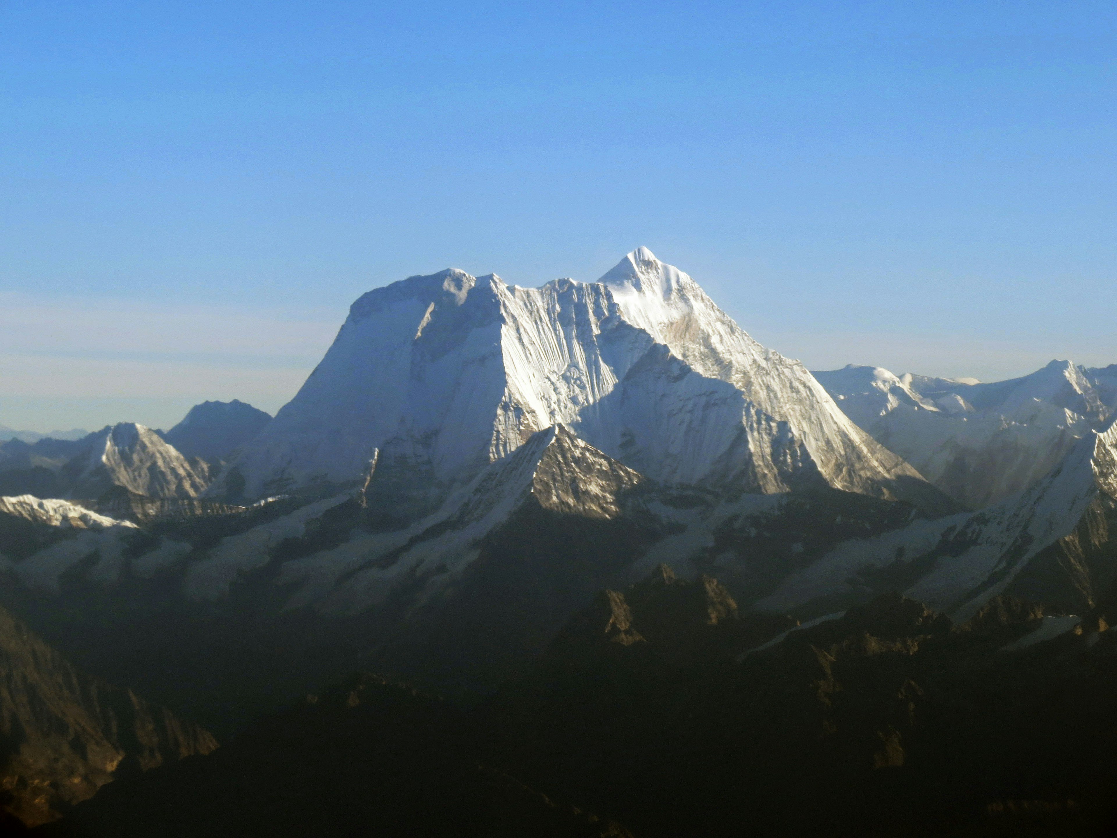 Snow-capped mountains under a clear blue sky