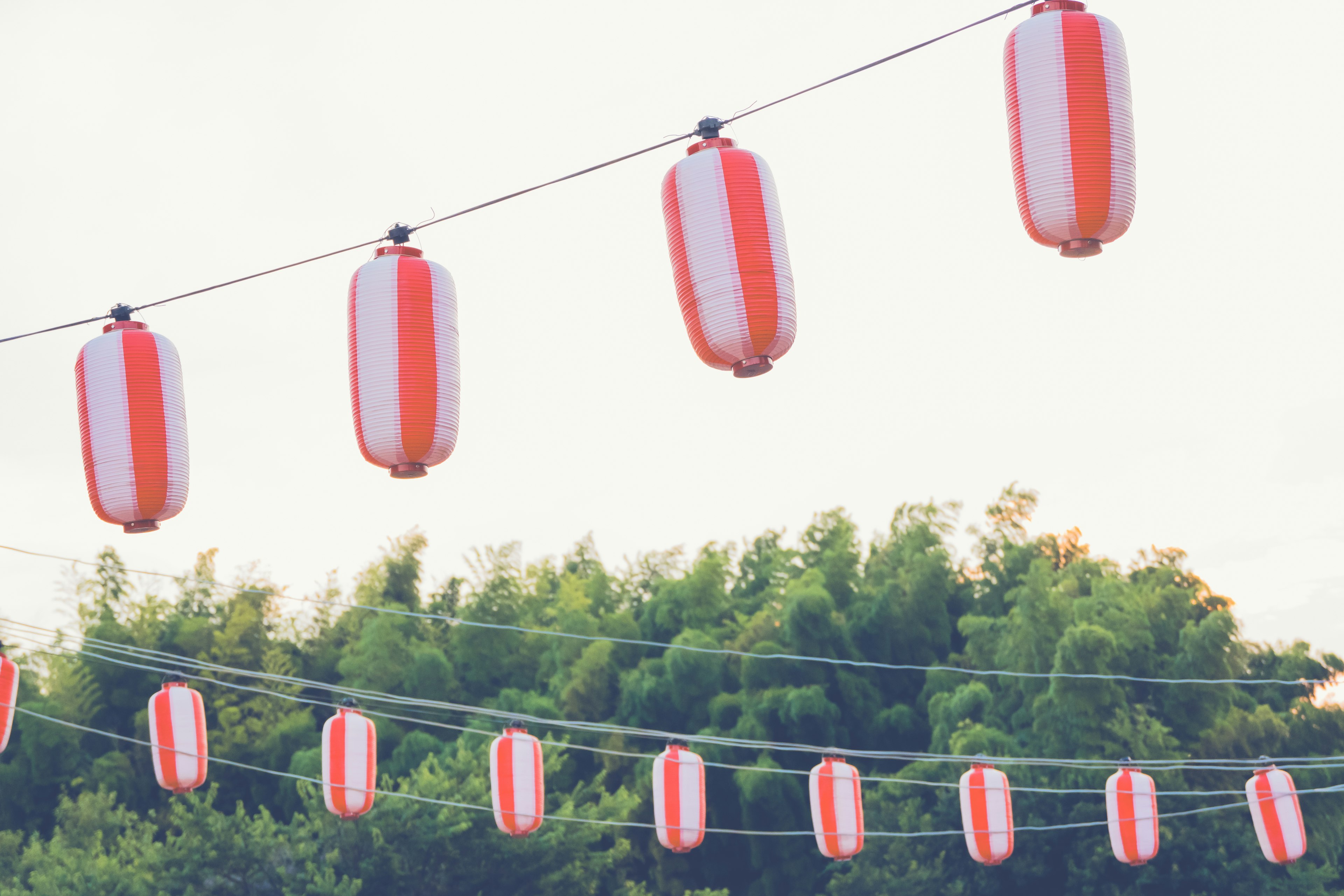 Red striped lanterns hanging against a soft background