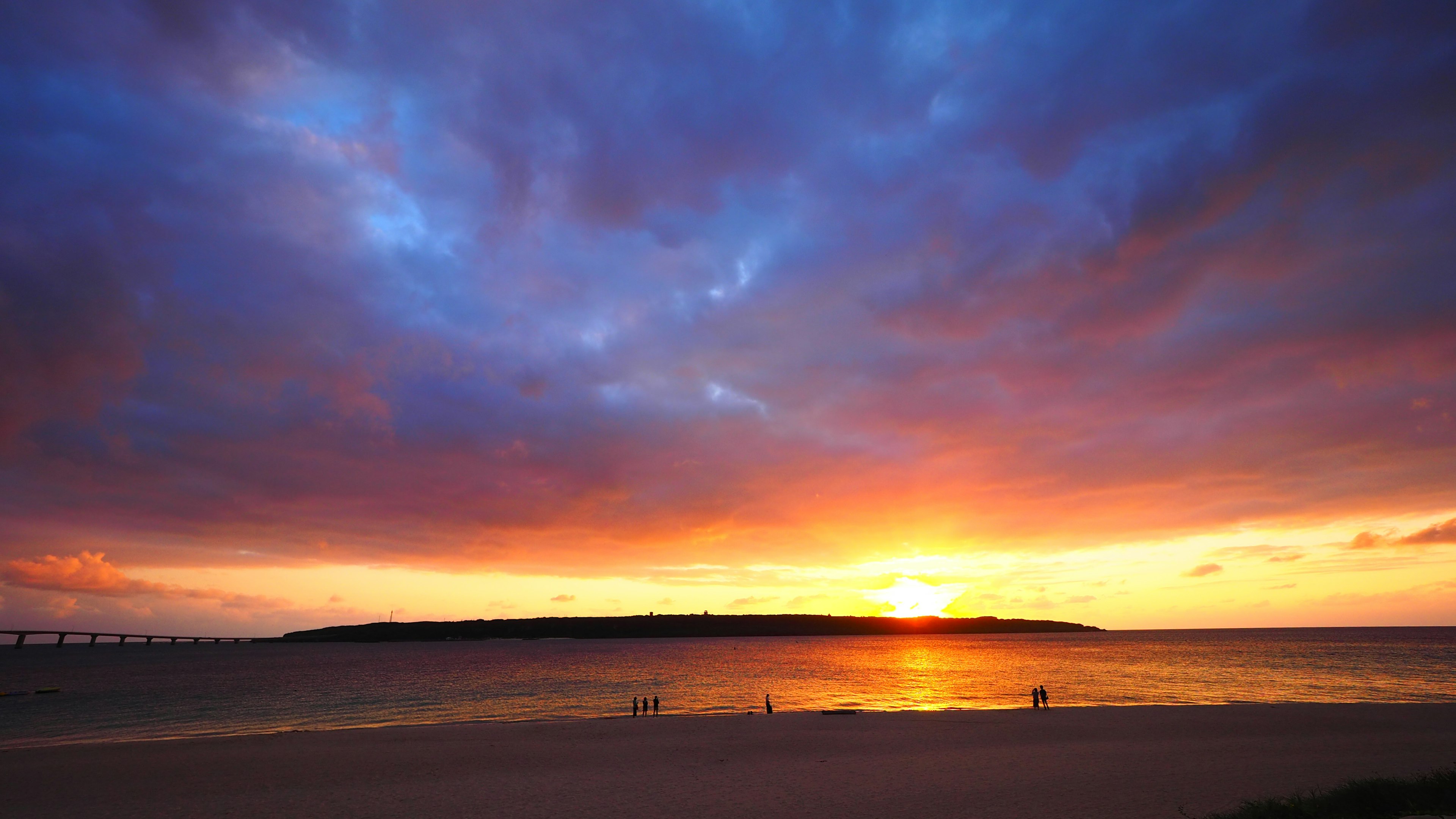 Scenic view of a sunset over the ocean with colorful clouds