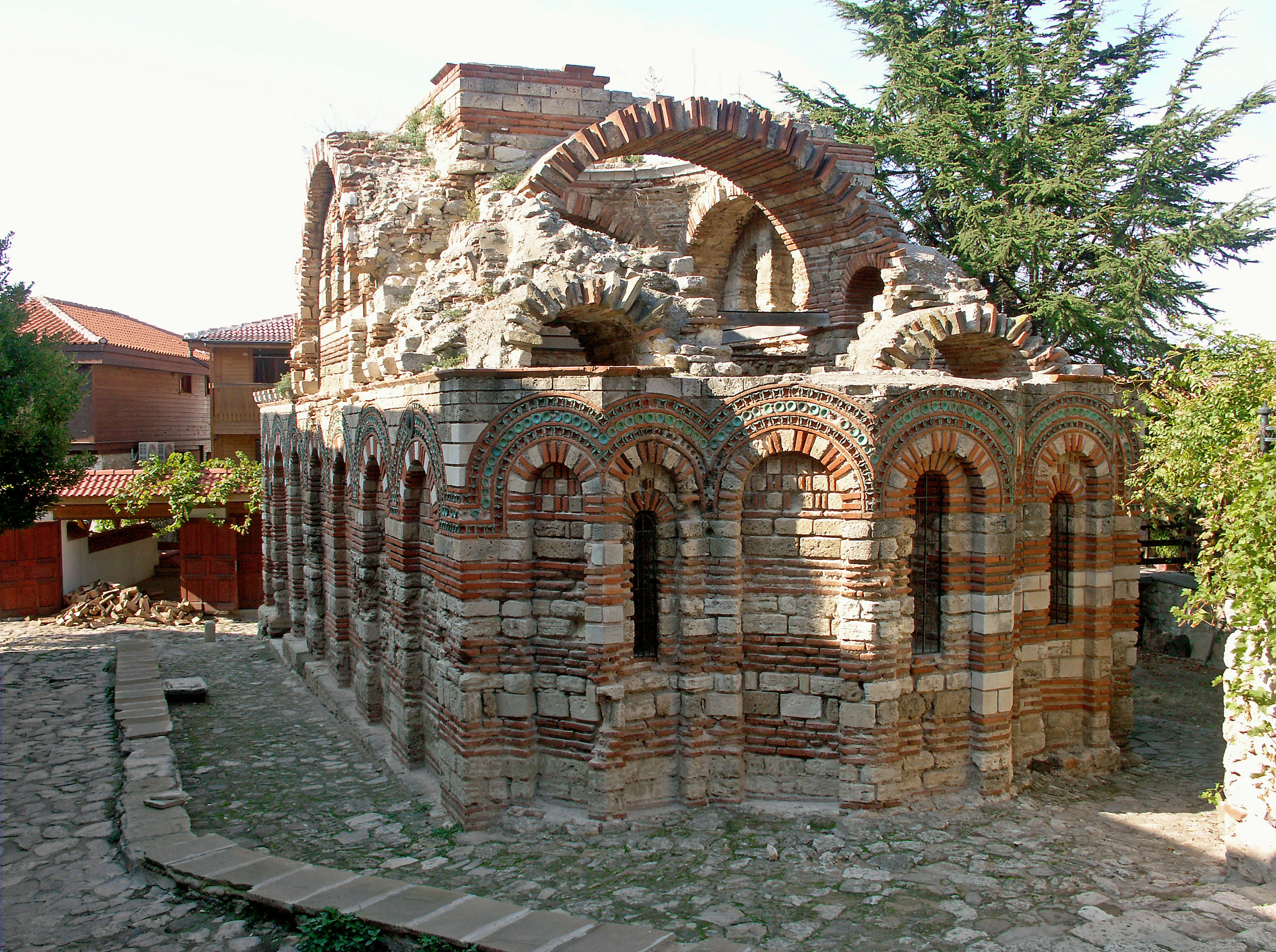 Remains of an ancient brick structure with arches and columns