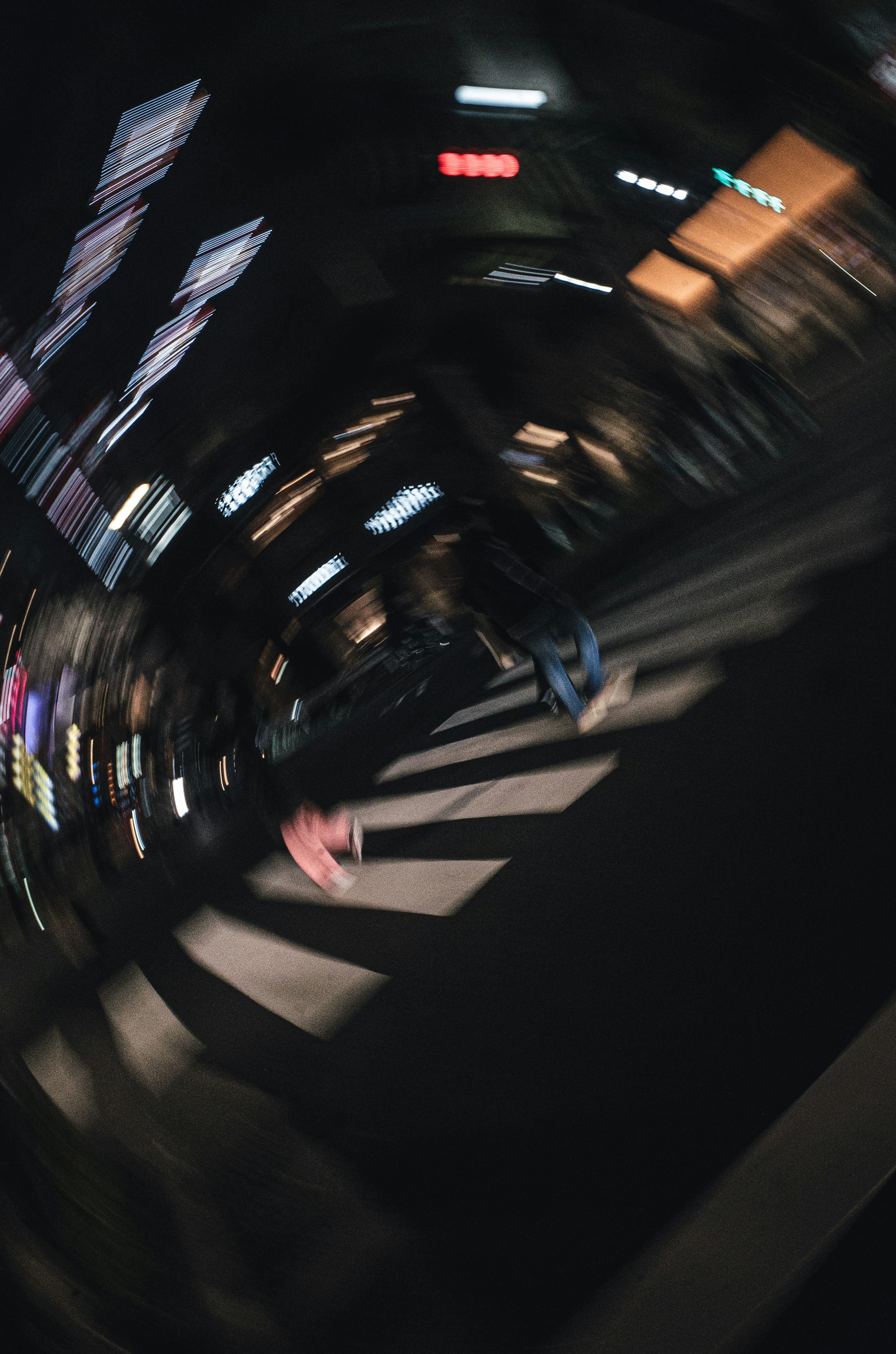 Blurred city night scene with pedestrians crossing the street