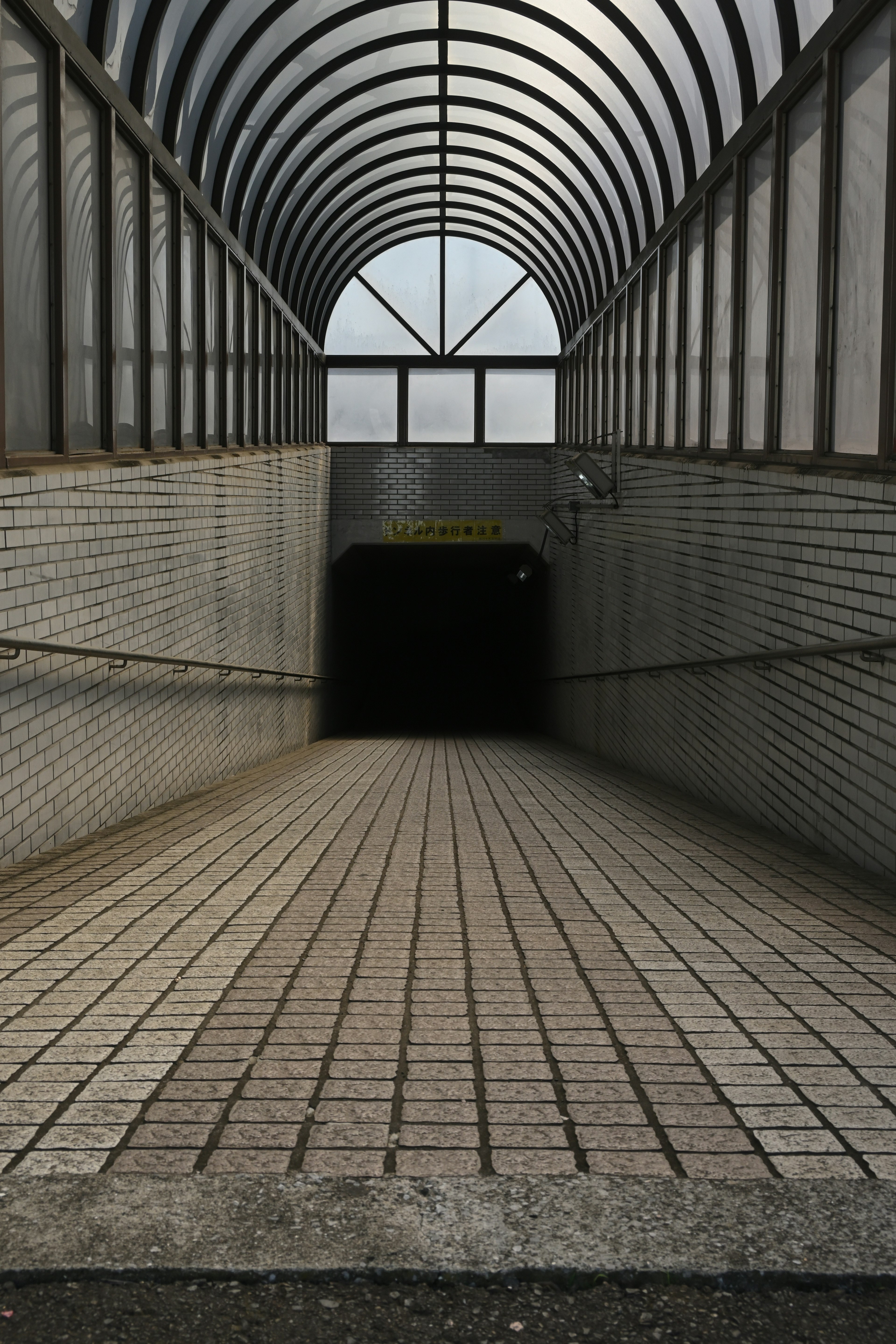 Interior view of a tunnel with a unique architectural structure and texture