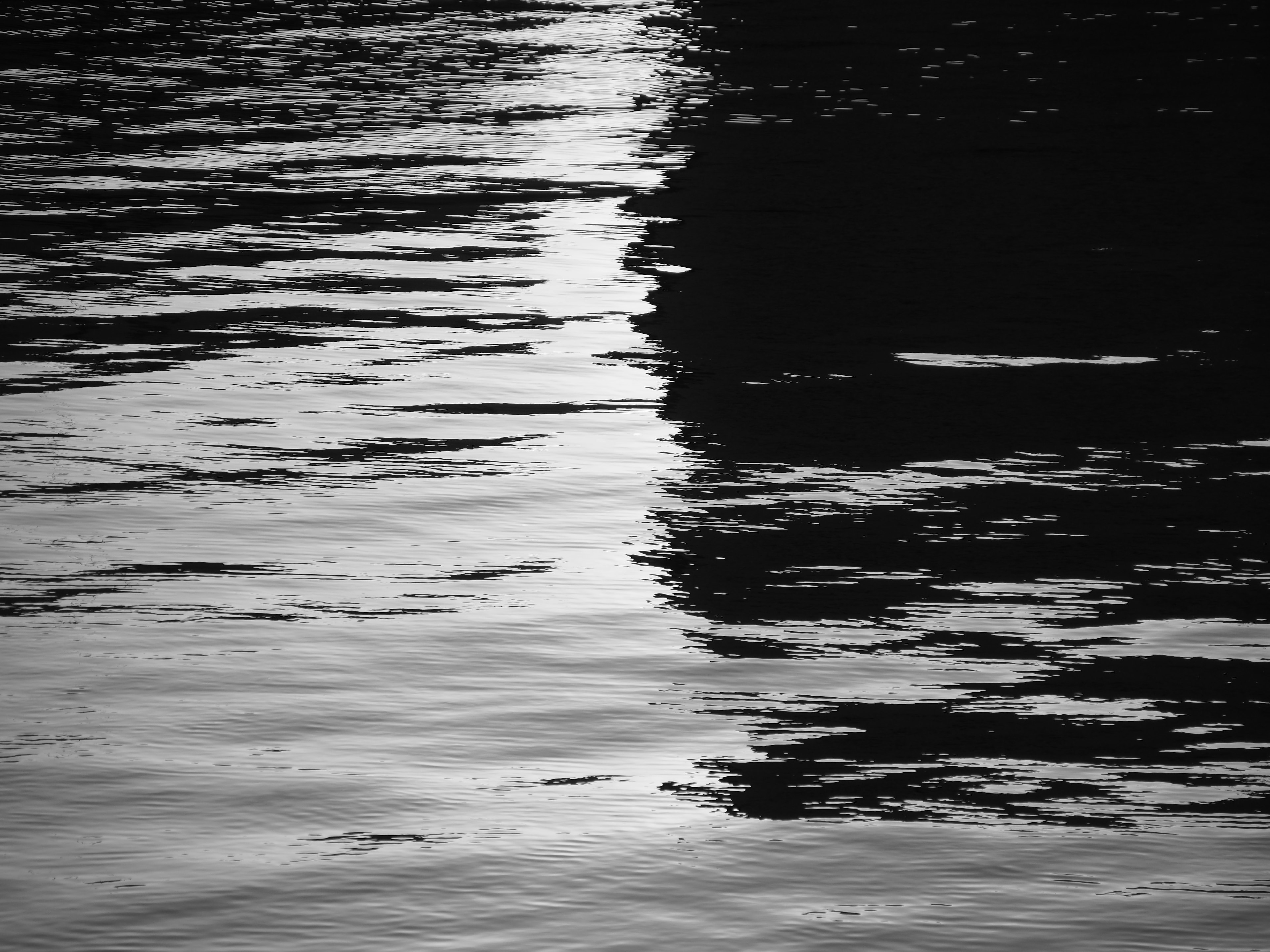 Contrast of light and shadow reflected on the water surface