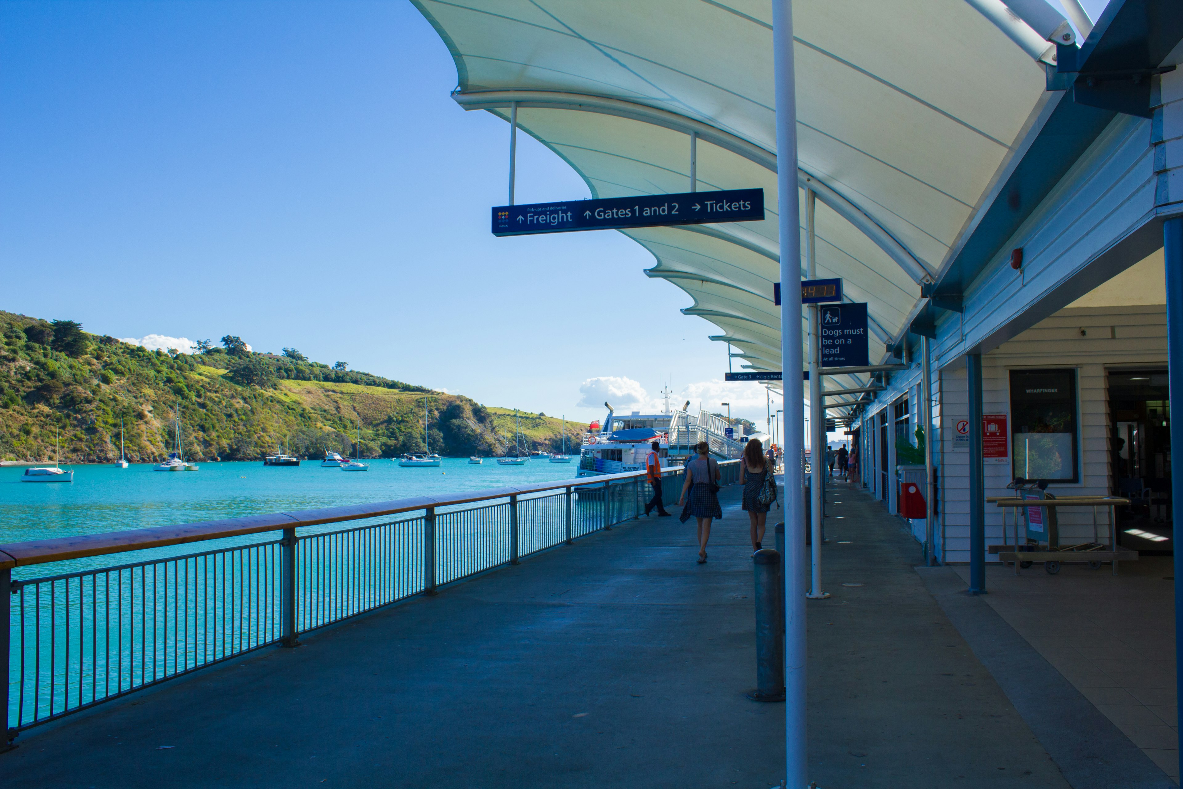 Scenic view of a pier with turquoise water and boats