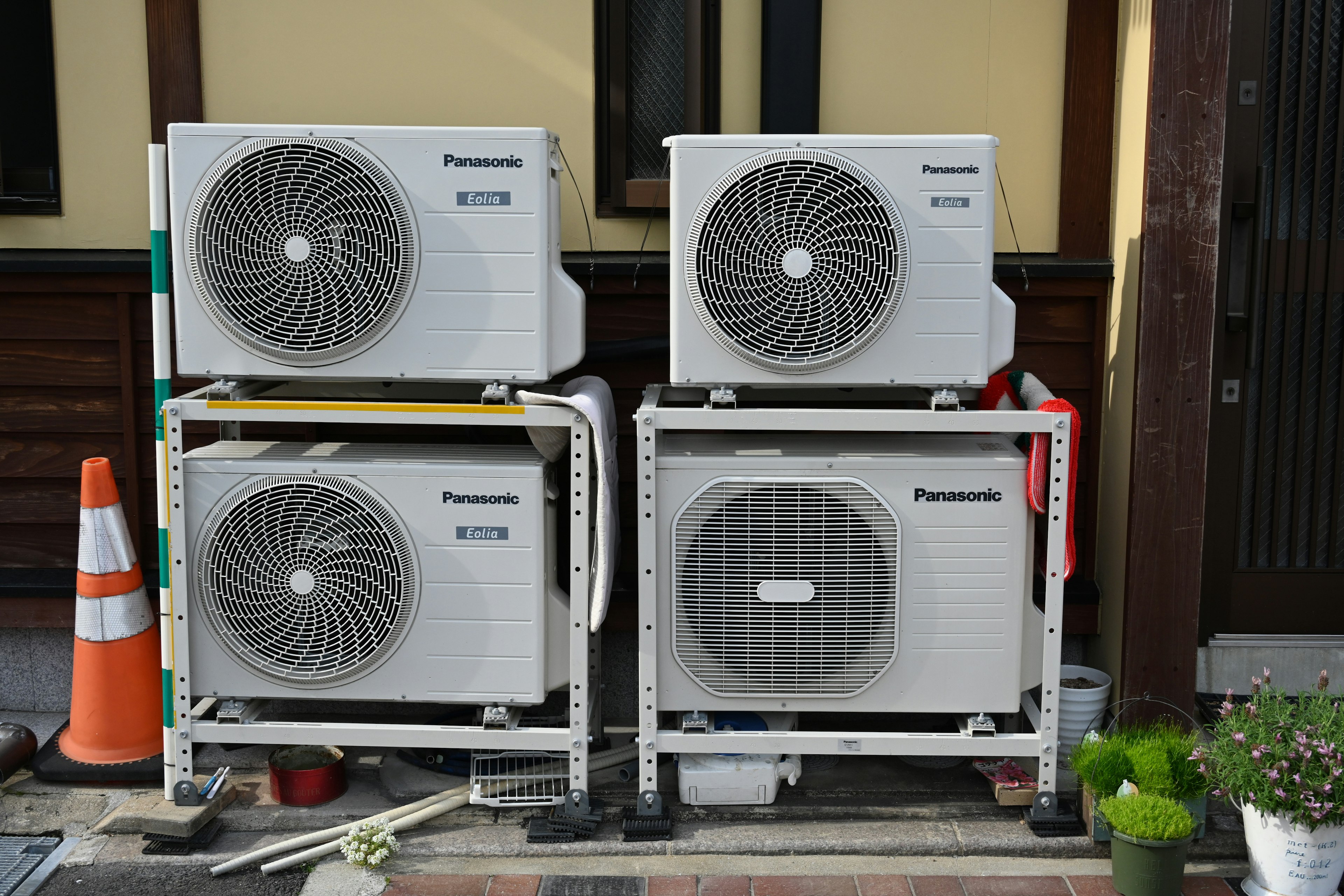 Stacked Panasonic air conditioning units in an outdoor setting