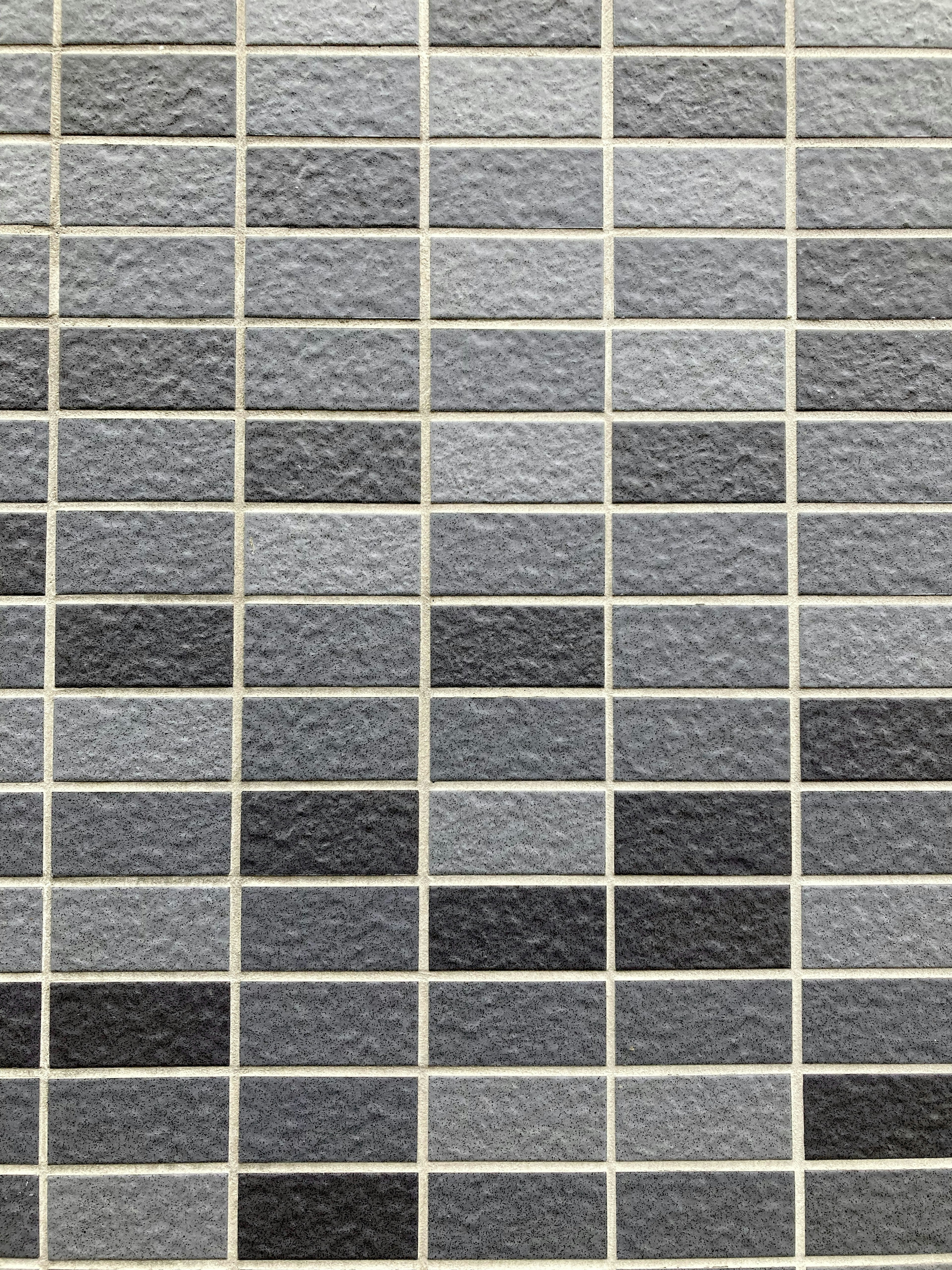 Grid of gray color tiles in various shades