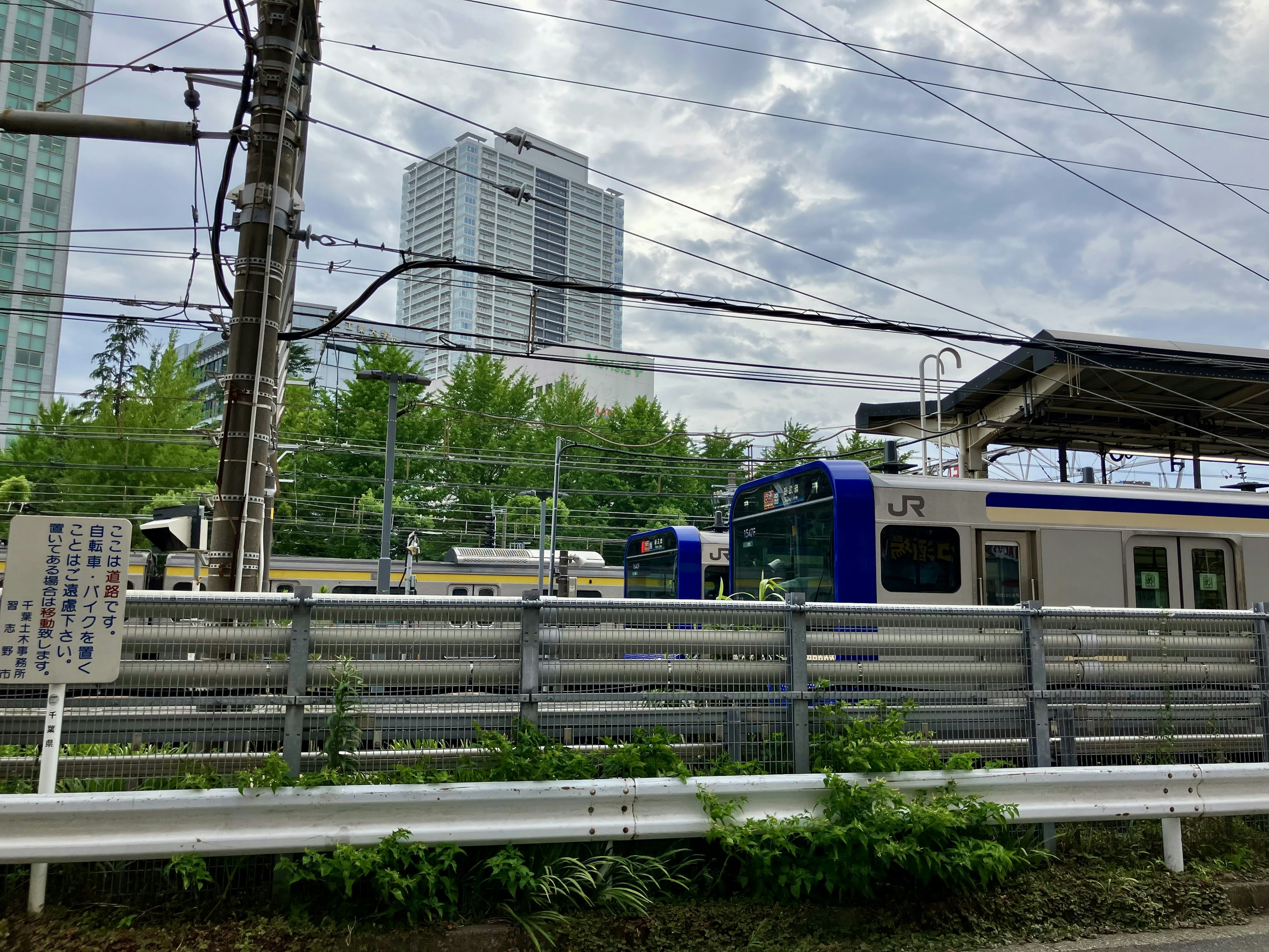 Urban landscape featuring a train station and train cars