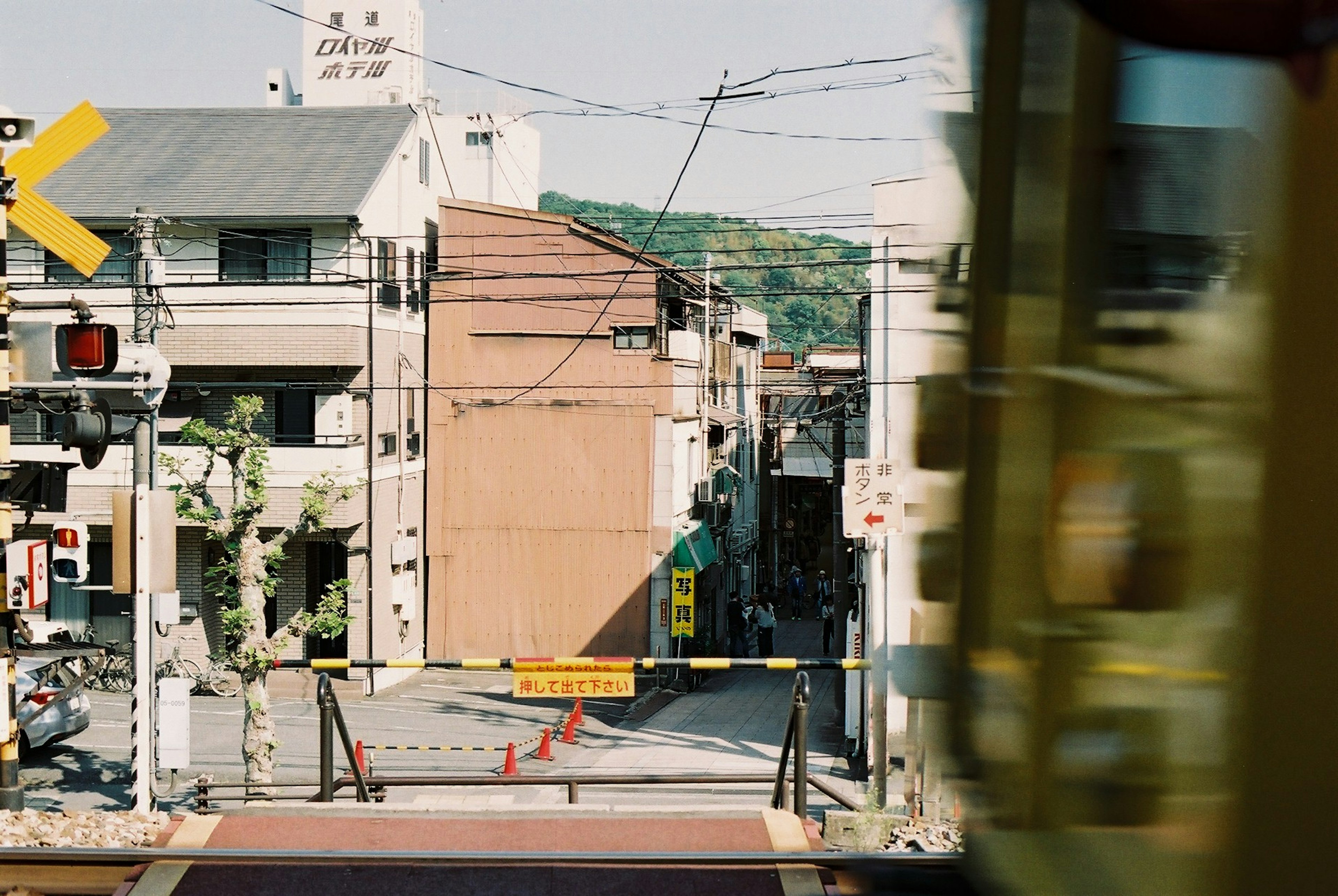 Street view with railway crossing and signal lights