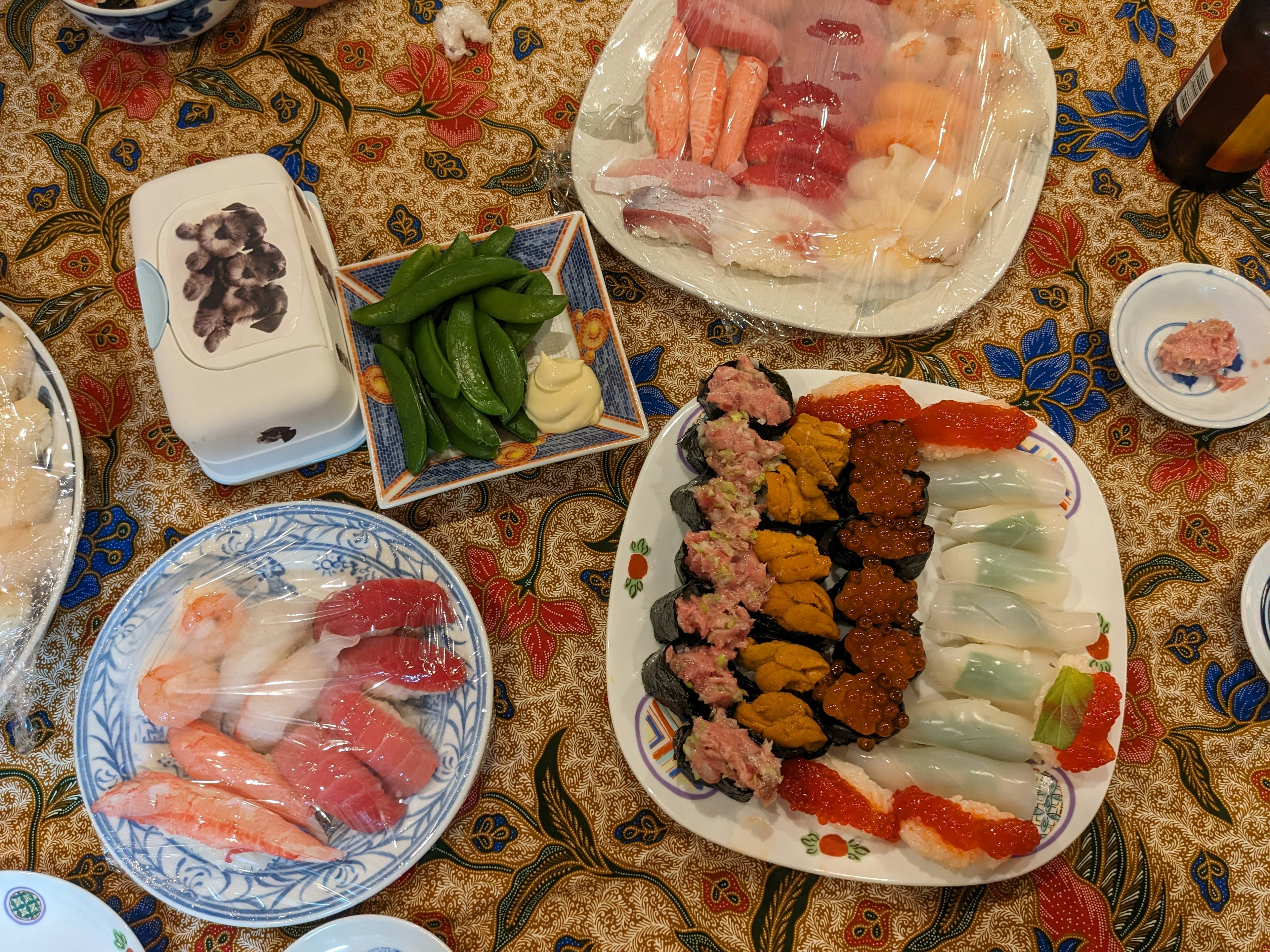 A colorful display of sushi and sashimi arranged on a table