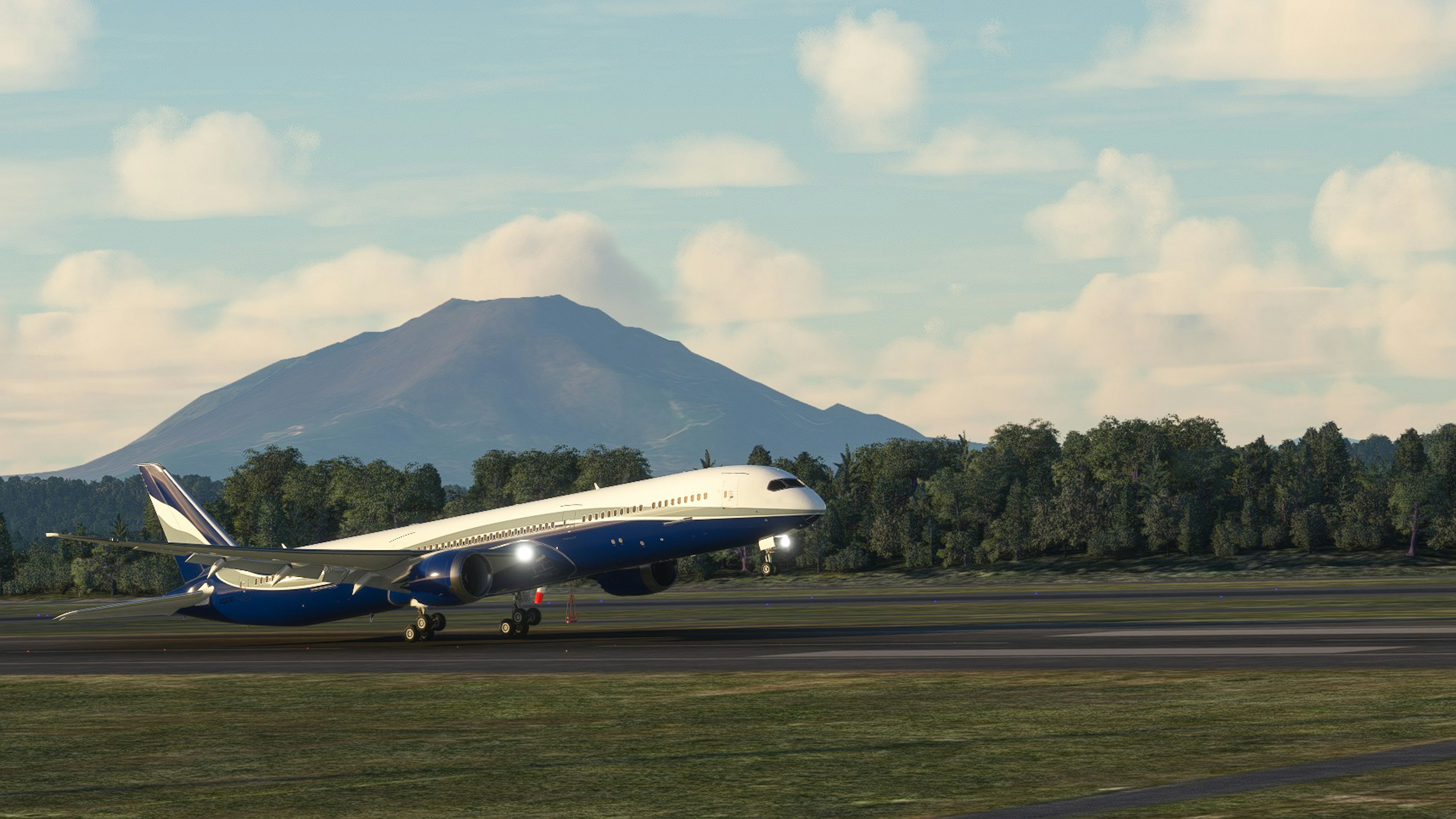 Avión azul despegando en la pista con una montaña de fondo