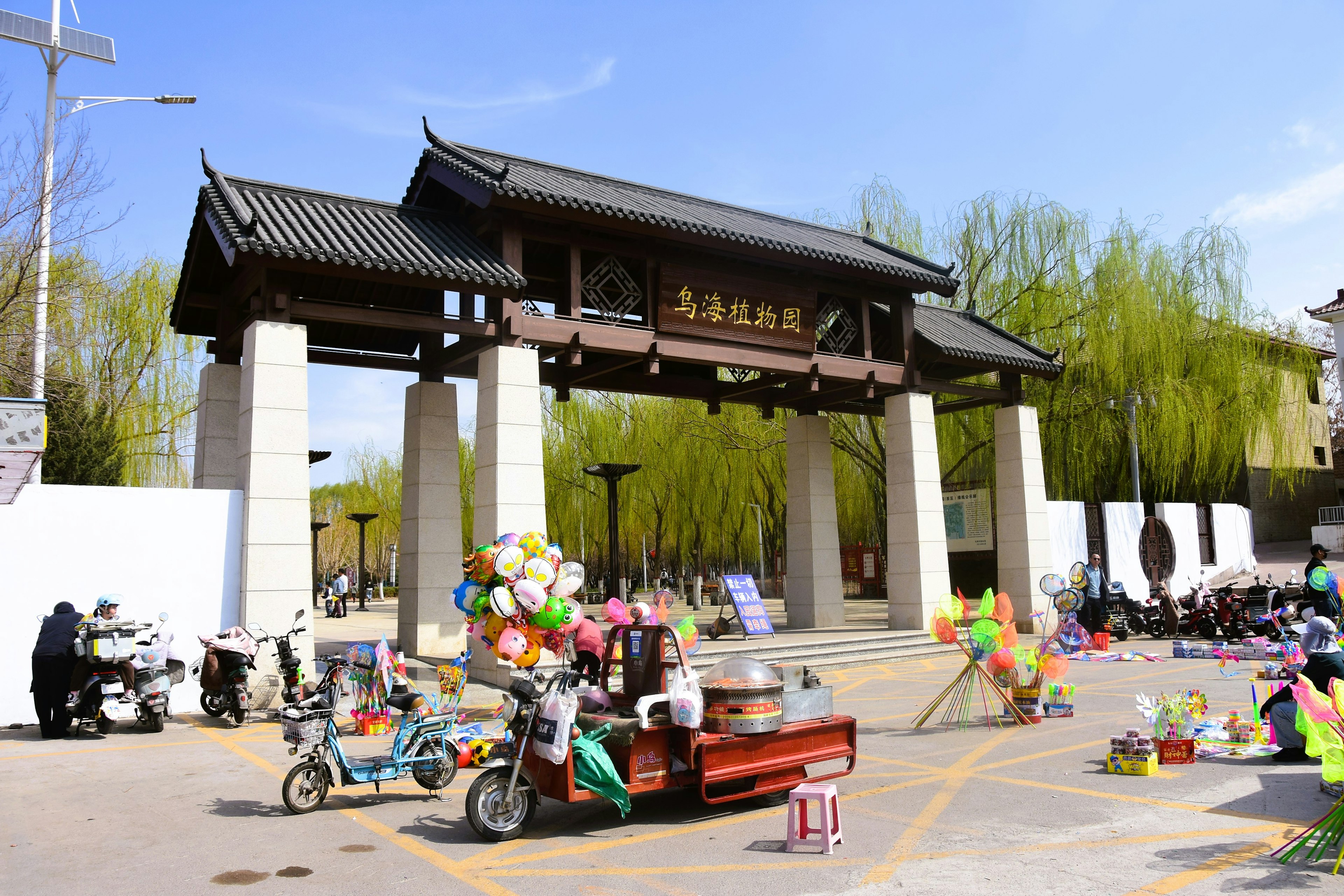 Traditional archway with colorful stalls and lively atmosphere