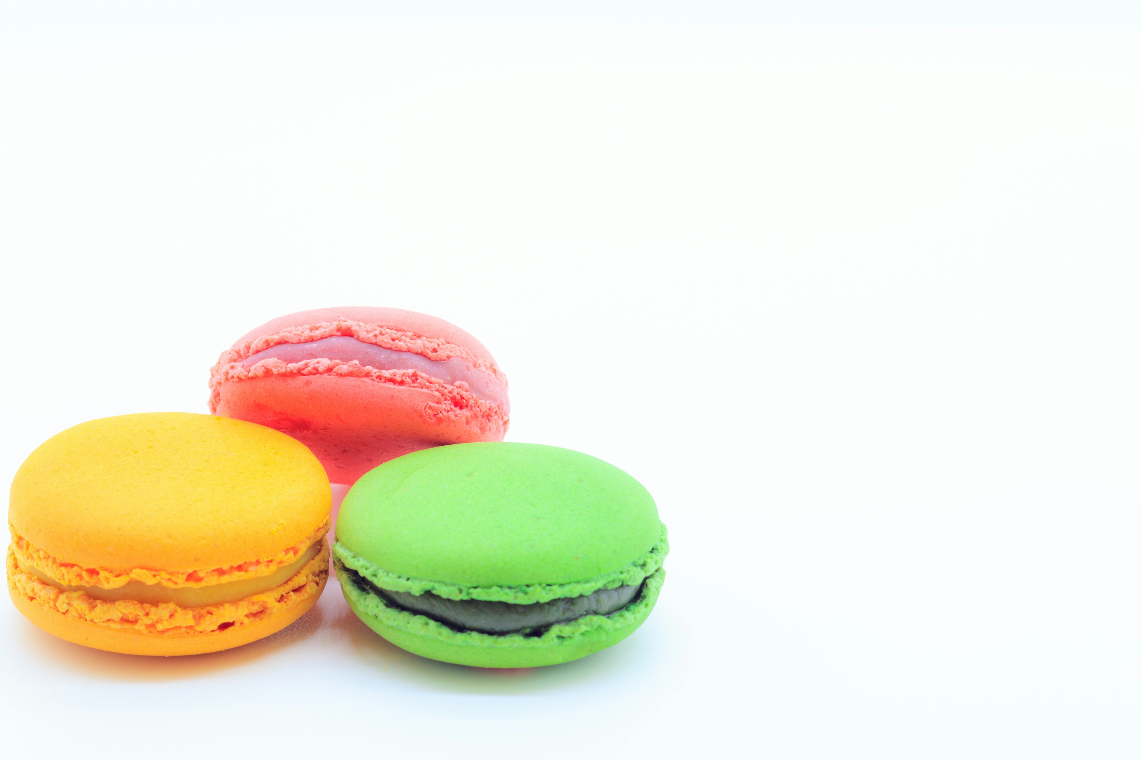 Three colorful macarons in vibrant colors