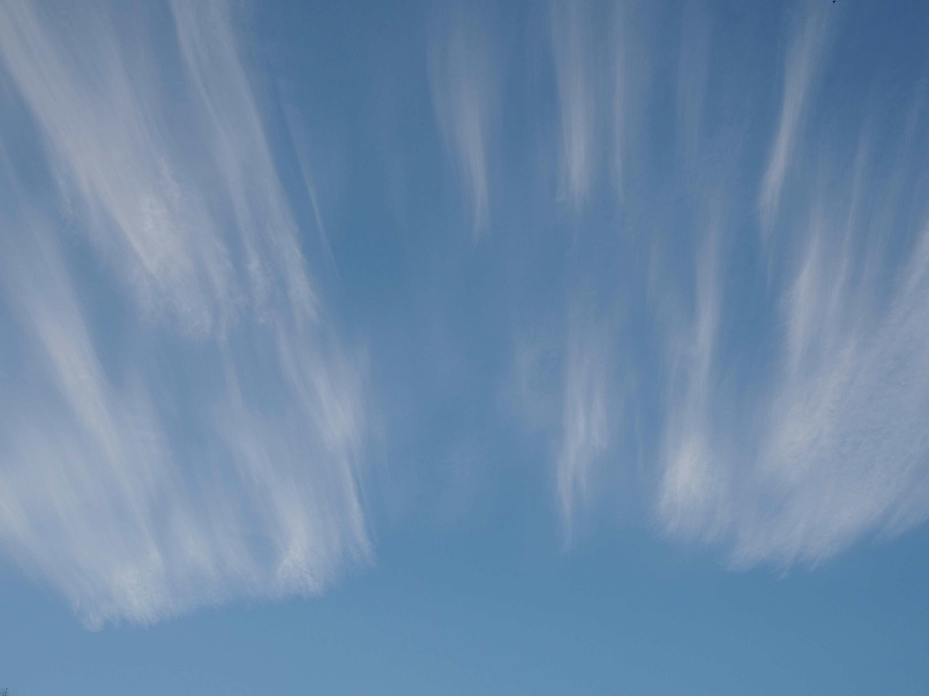 Beautiful patterns of flowing clouds in a blue sky