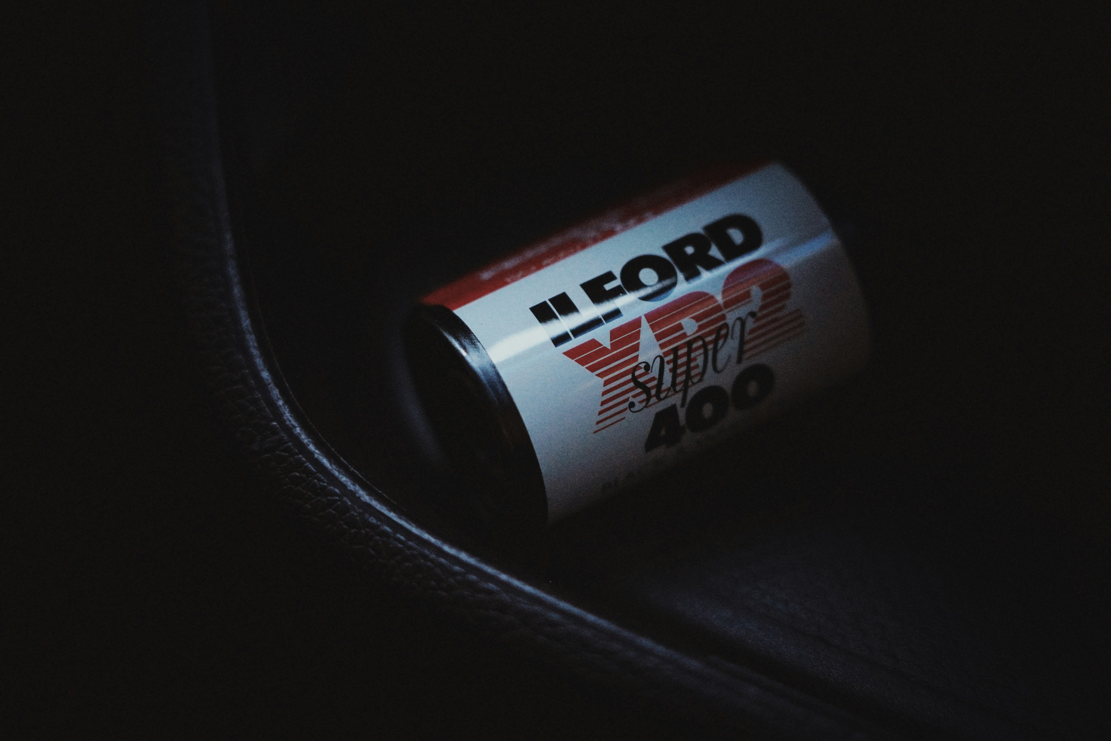 Vintage Ford 400 can resting in a dark setting