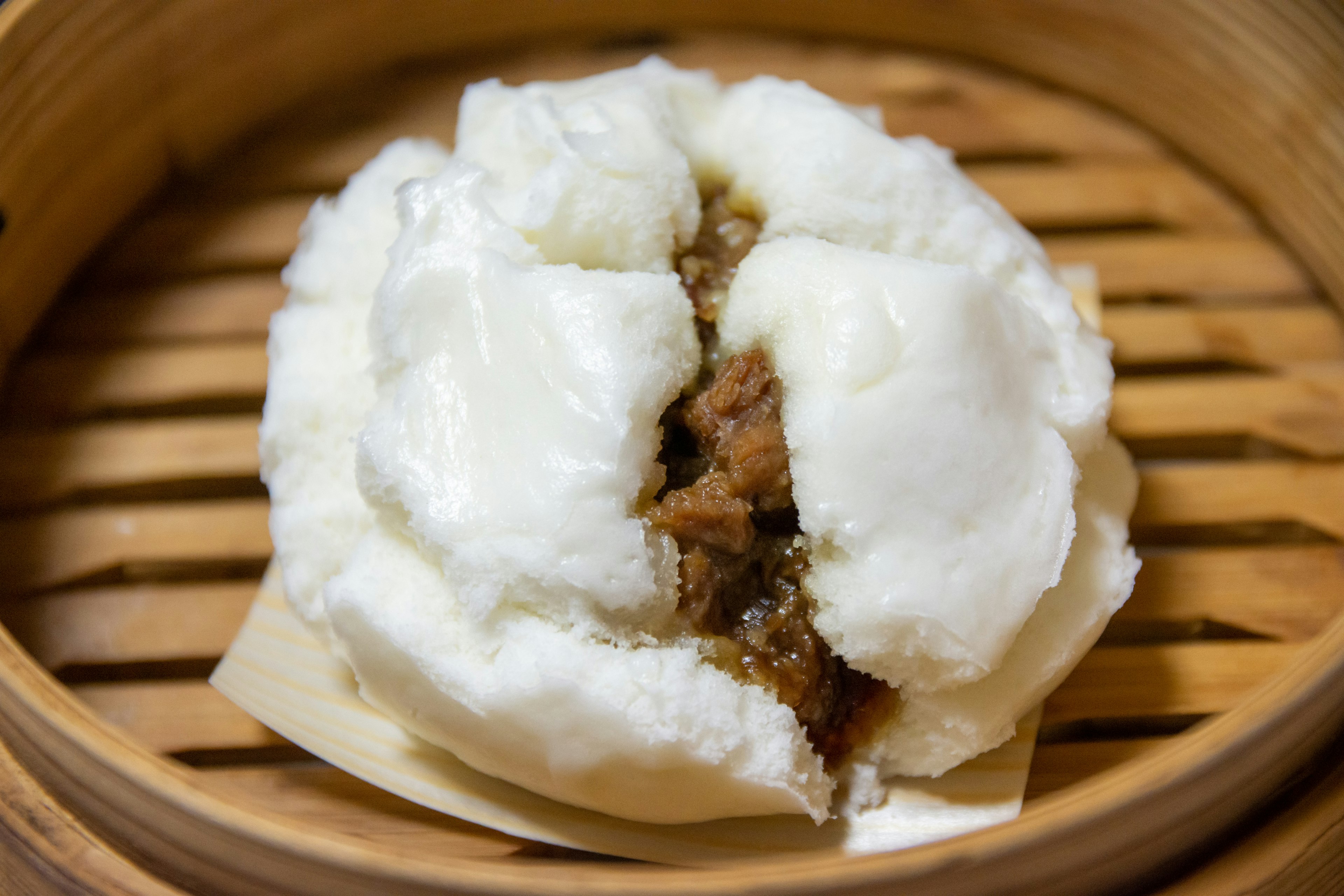 Steamed bun filled with meat