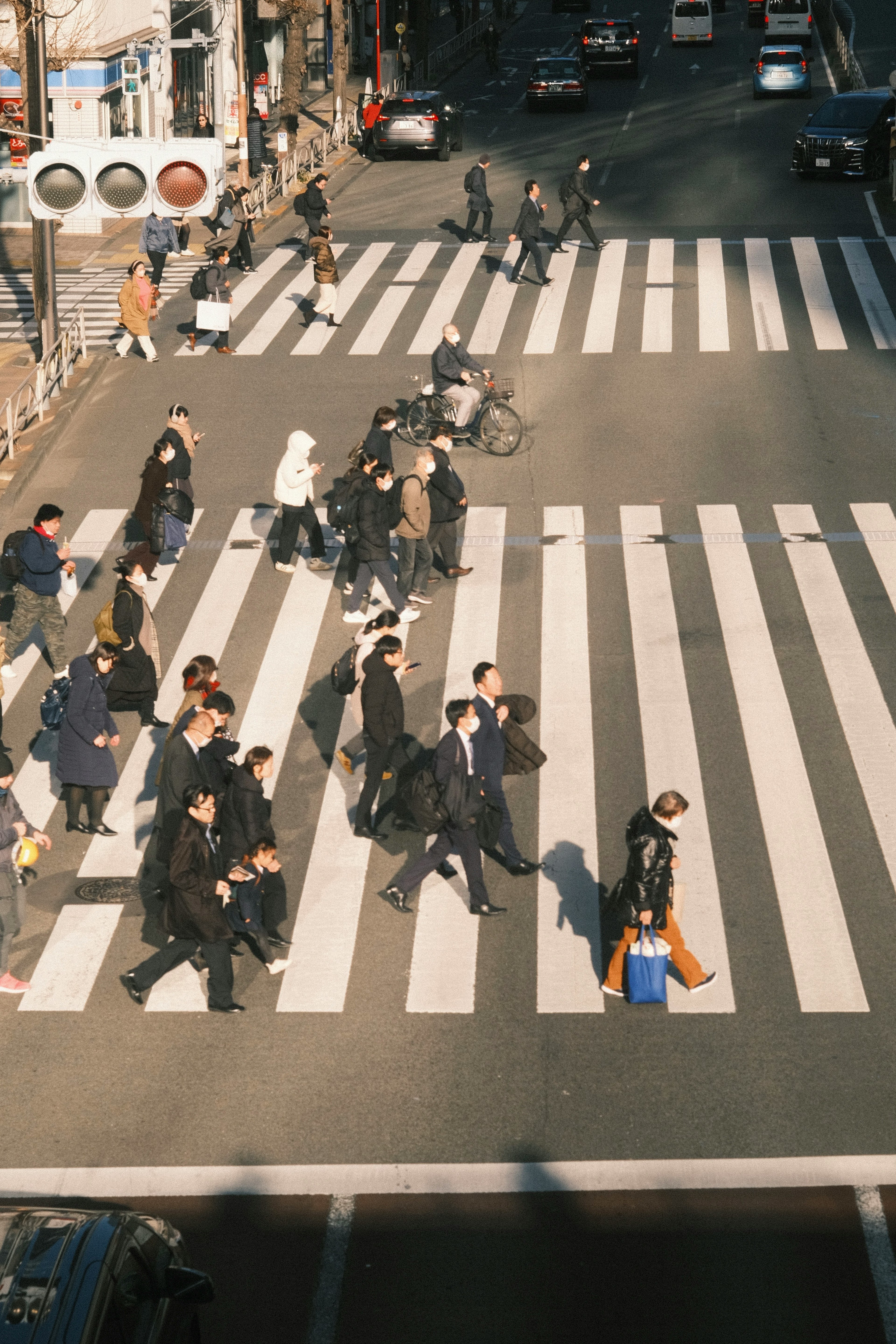 Pedestrians crossing a street at a crosswalk