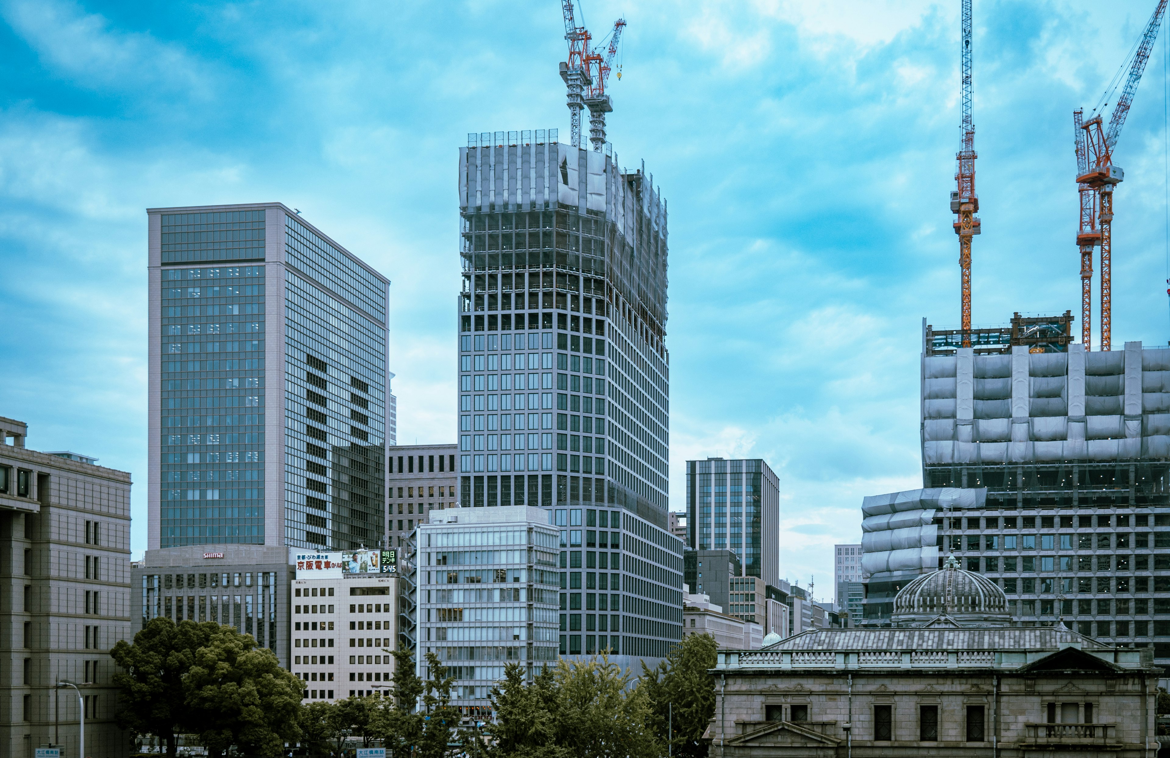 Modern skyline with high-rise buildings and blue sky