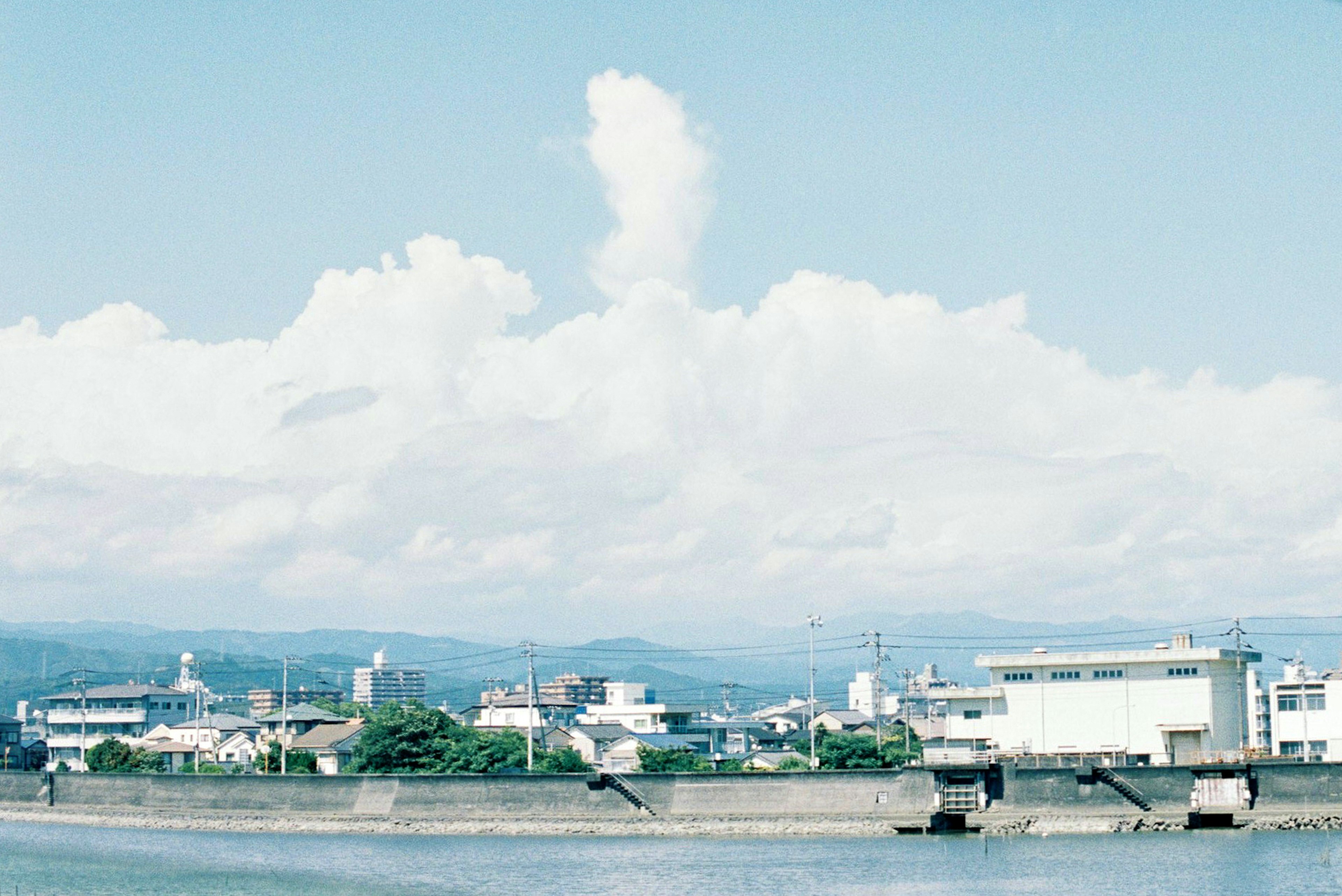 Urban landscape with blue sky and white clouds