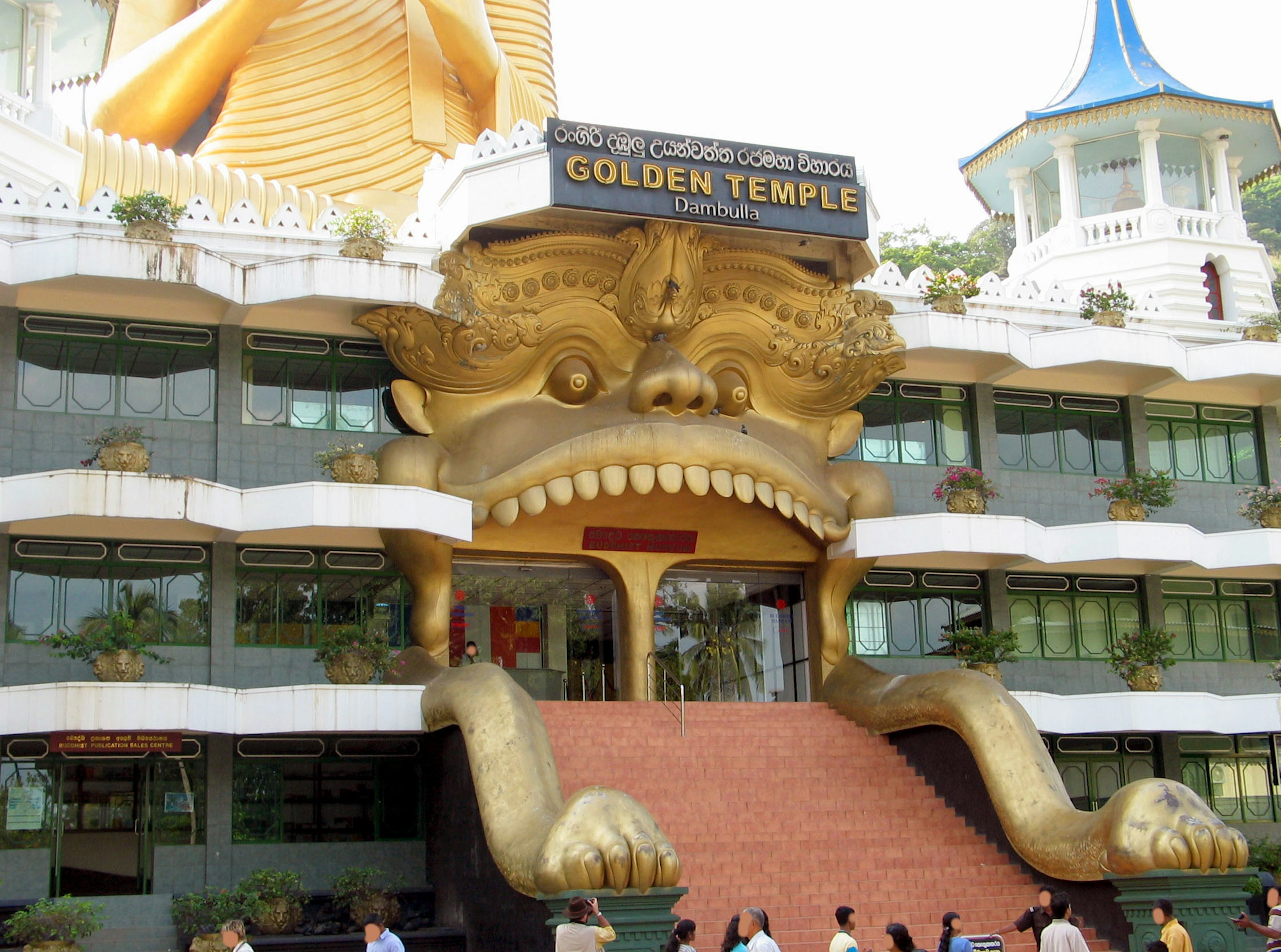 Unique facade of the Golden Temple featuring a large face sculpture