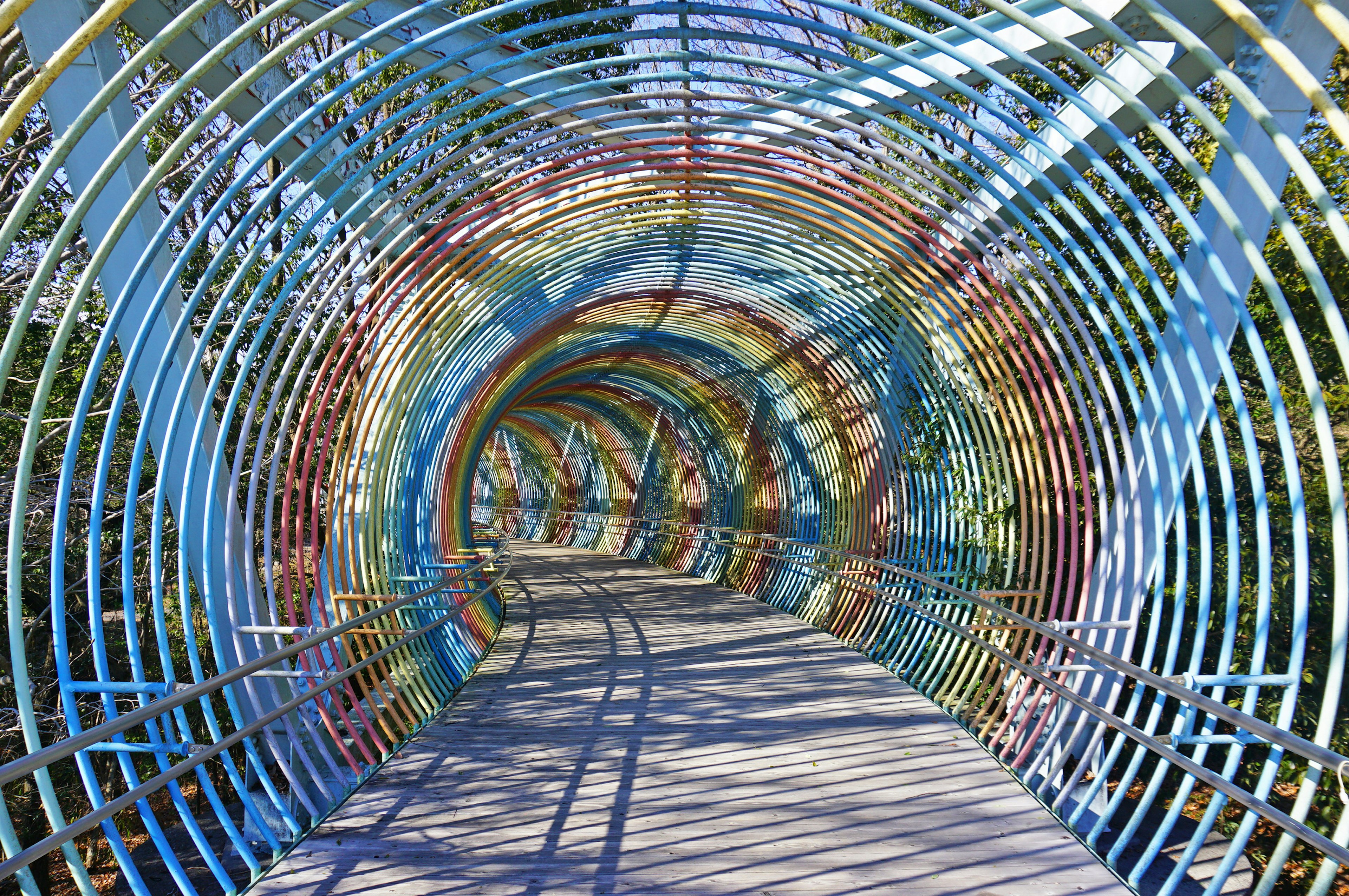 Colorful metal tunnel structure with visible walkway