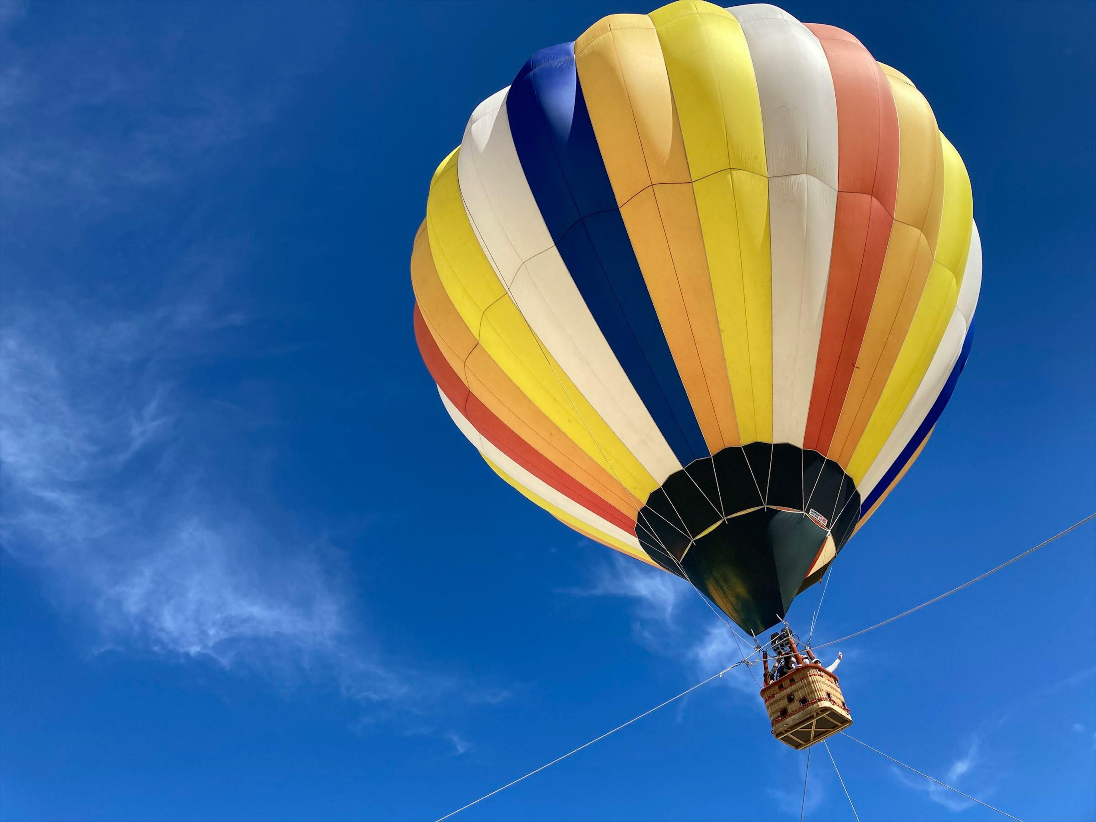 Colorful hot air balloon against a blue sky