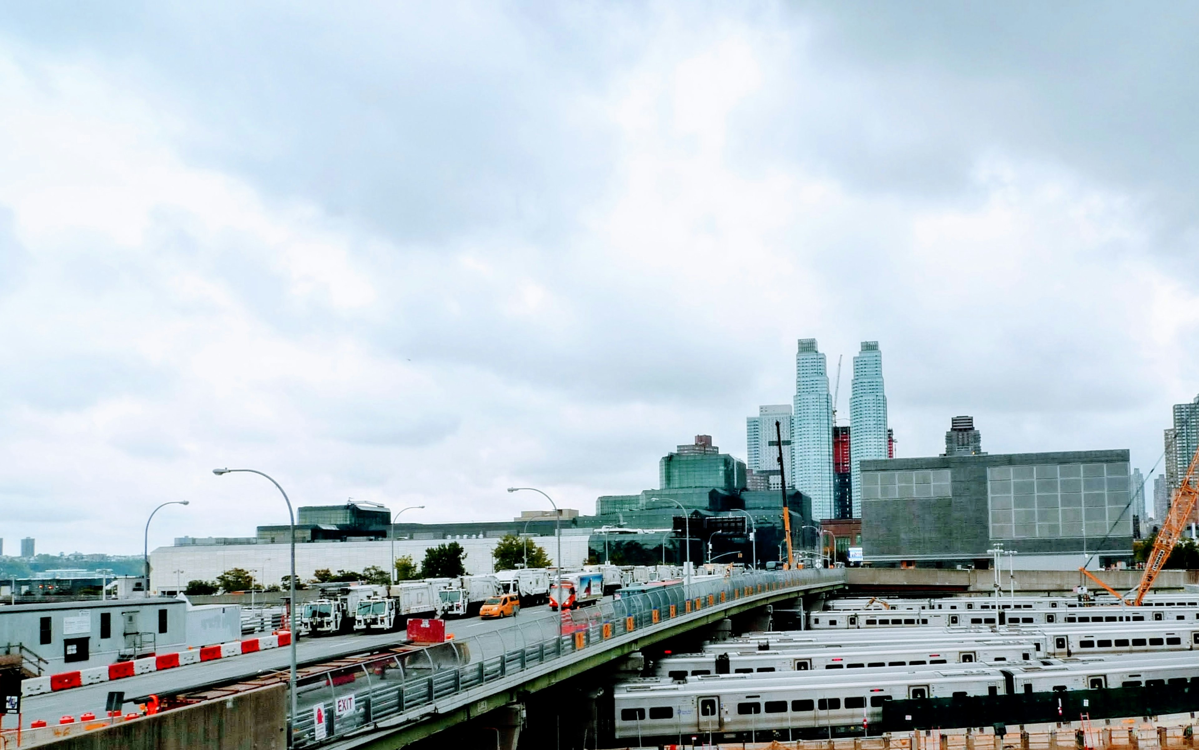 Urban landscape featuring skyscrapers and a cloudy sky