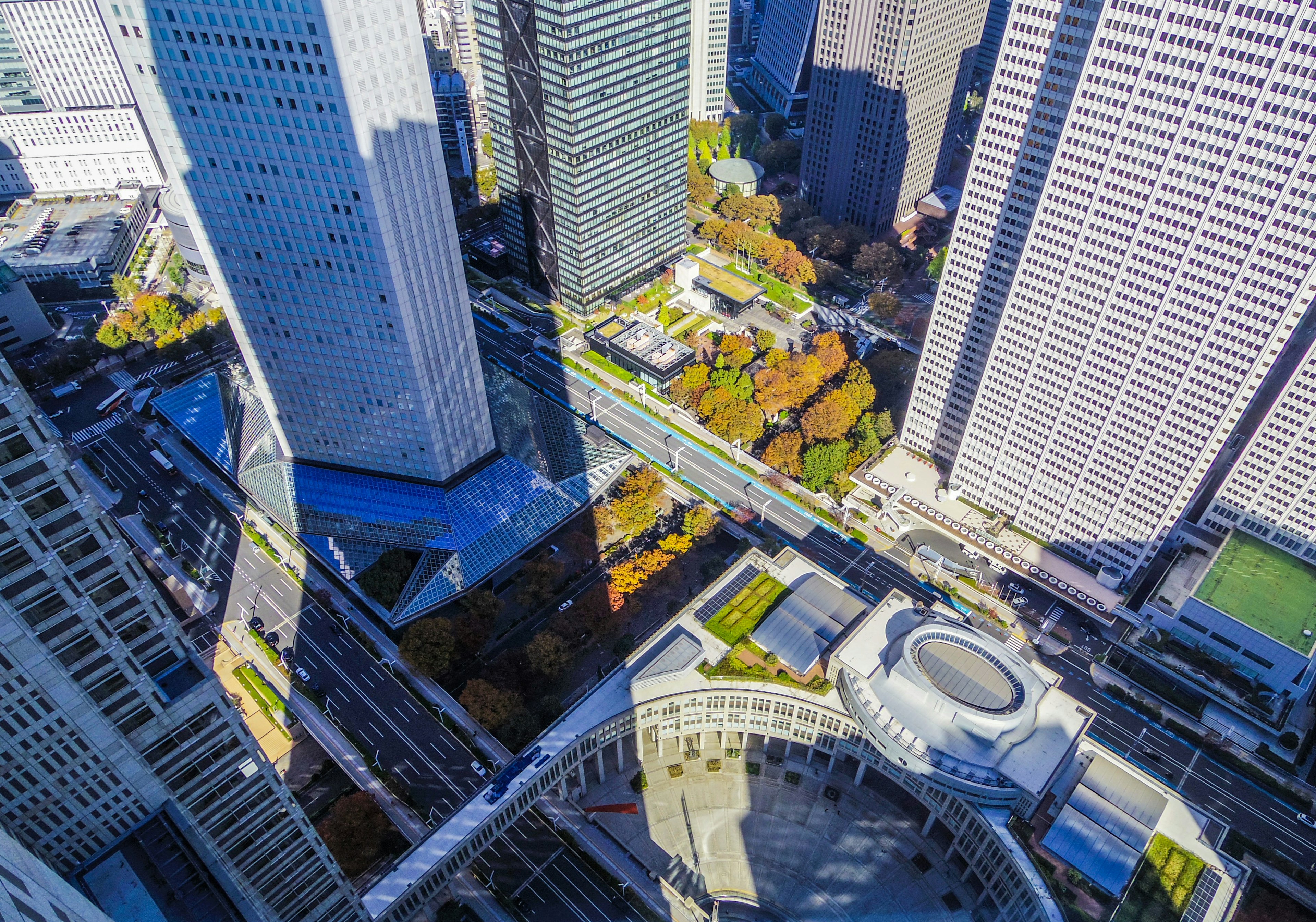 Aerial view of skyscrapers and green spaces in an urban setting