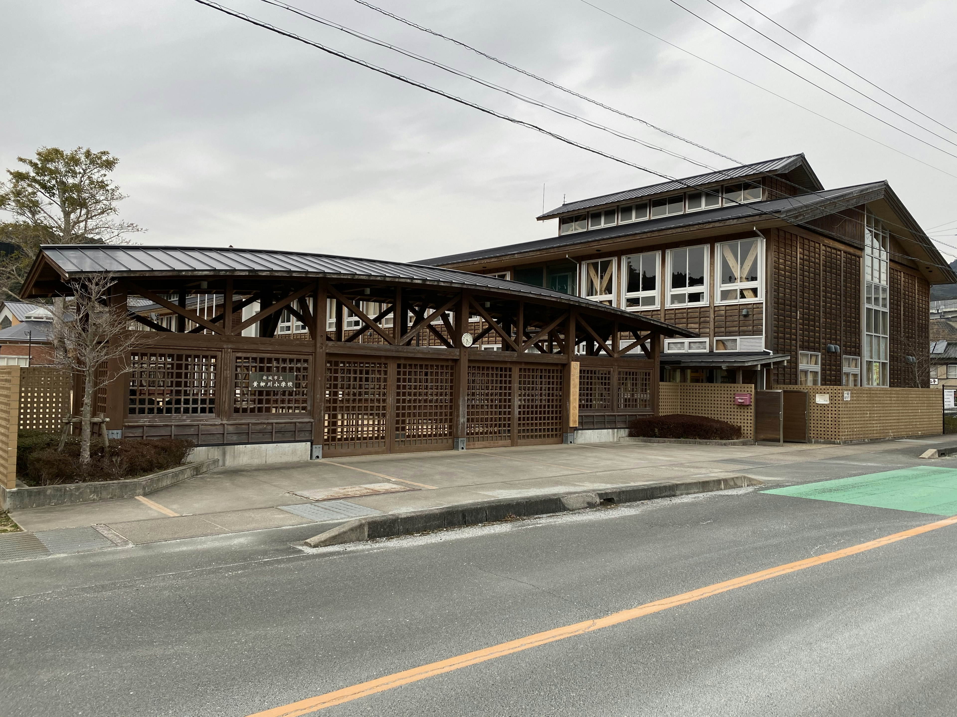 Wooden building with a distinctive roof showcasing Japanese architecture