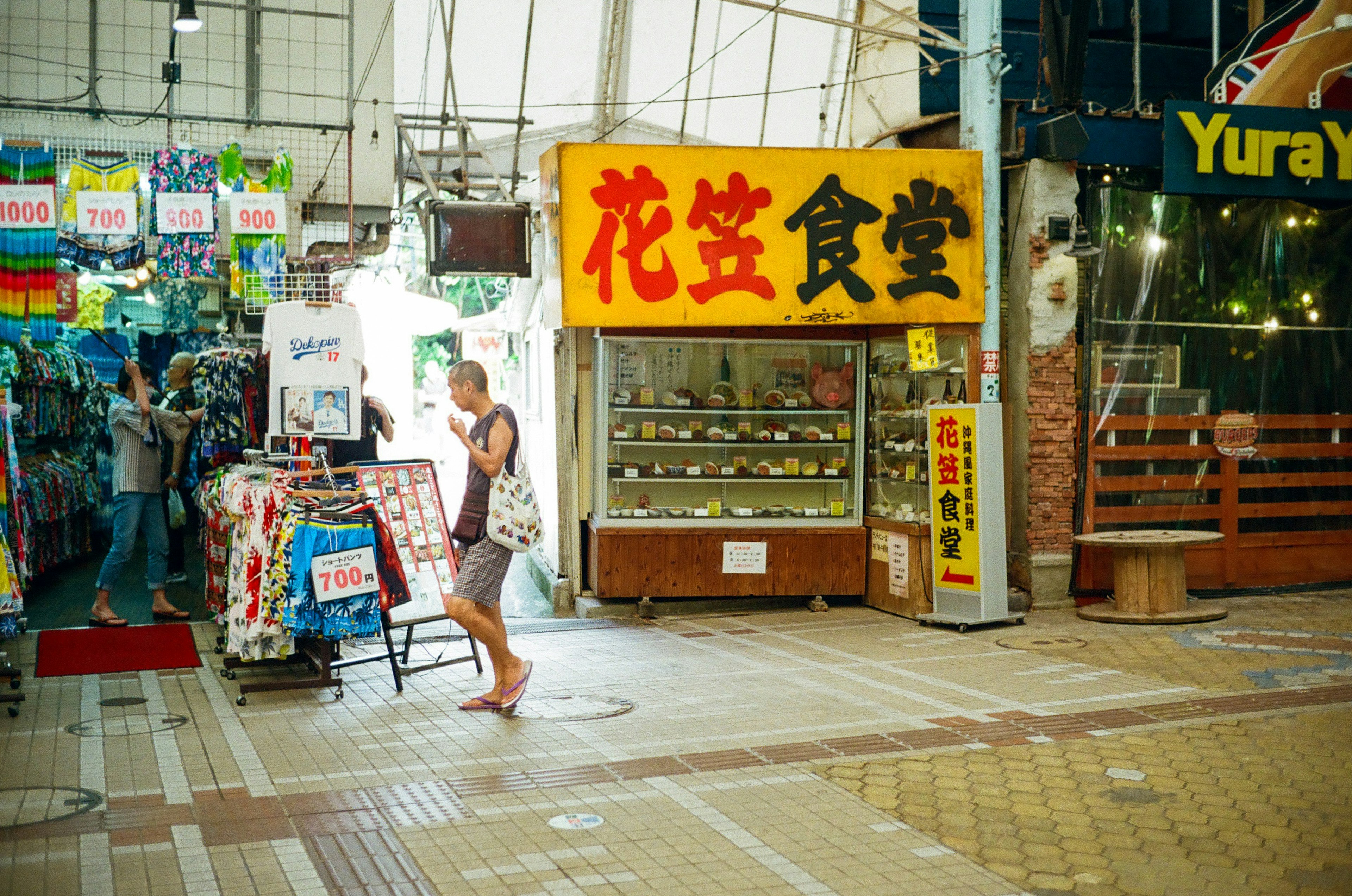 Vibrant market scene featuring a yellow sign restaurant