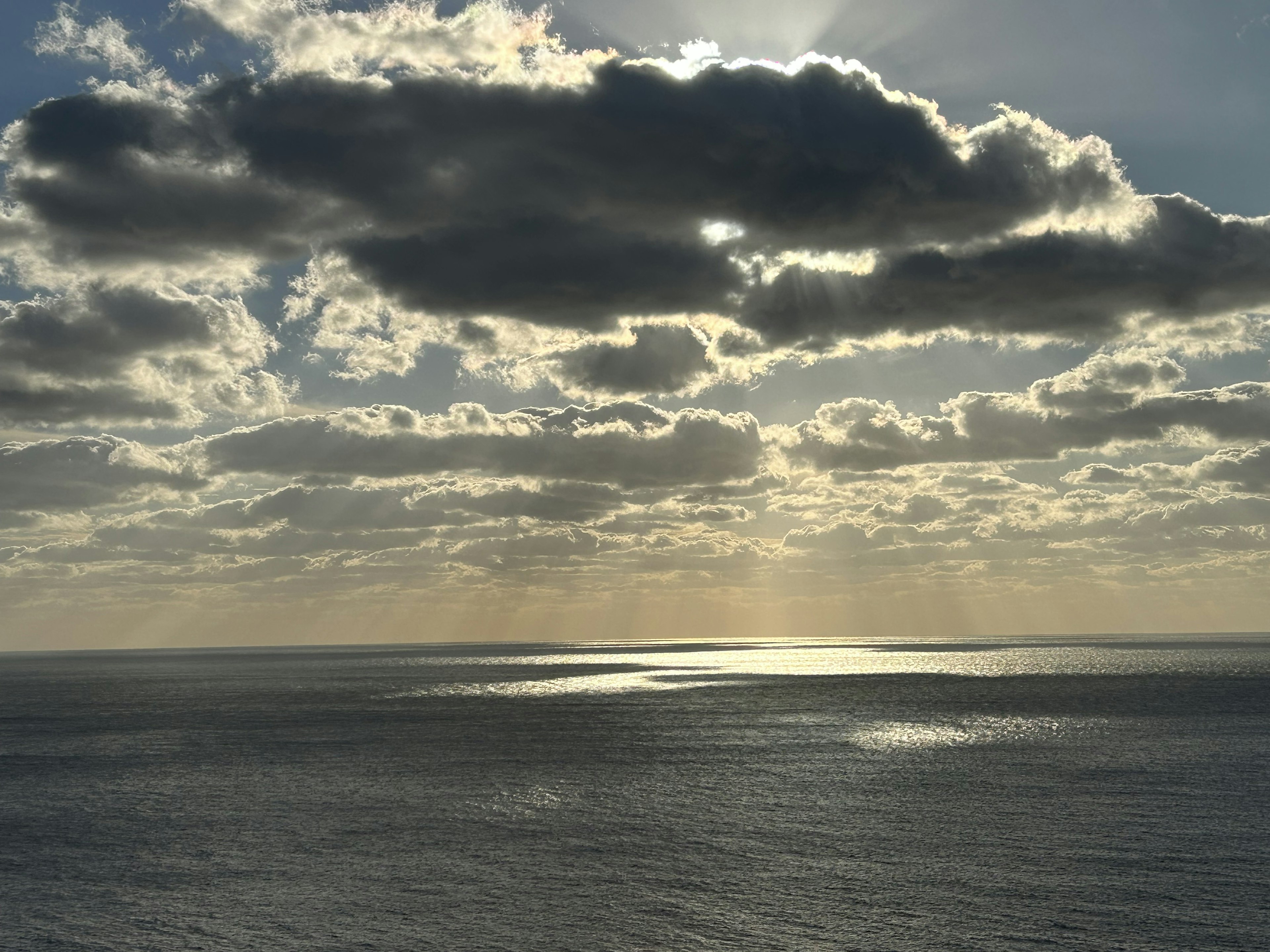 Seascape with sunlight filtering through clouds