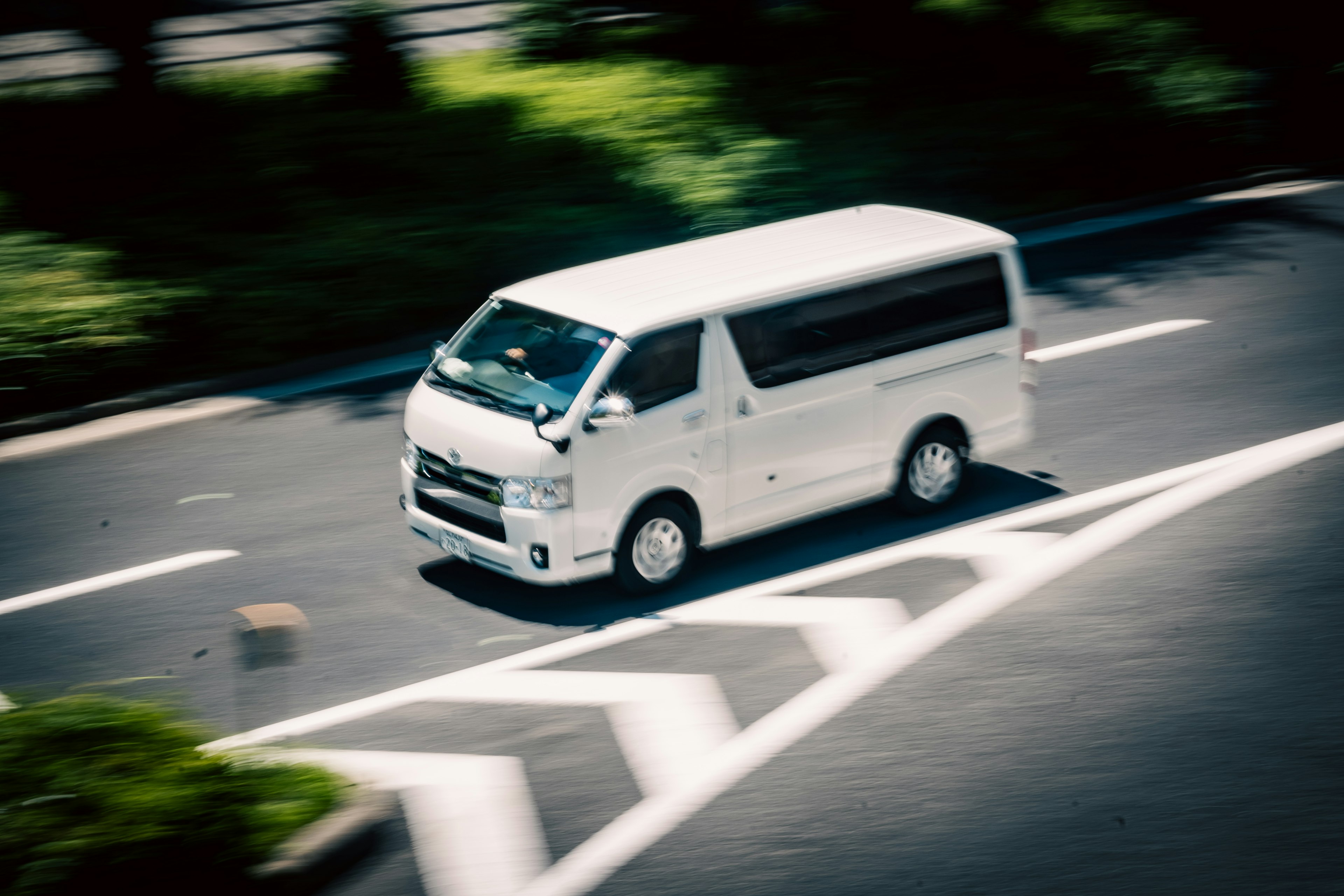 A white van turning on a city road