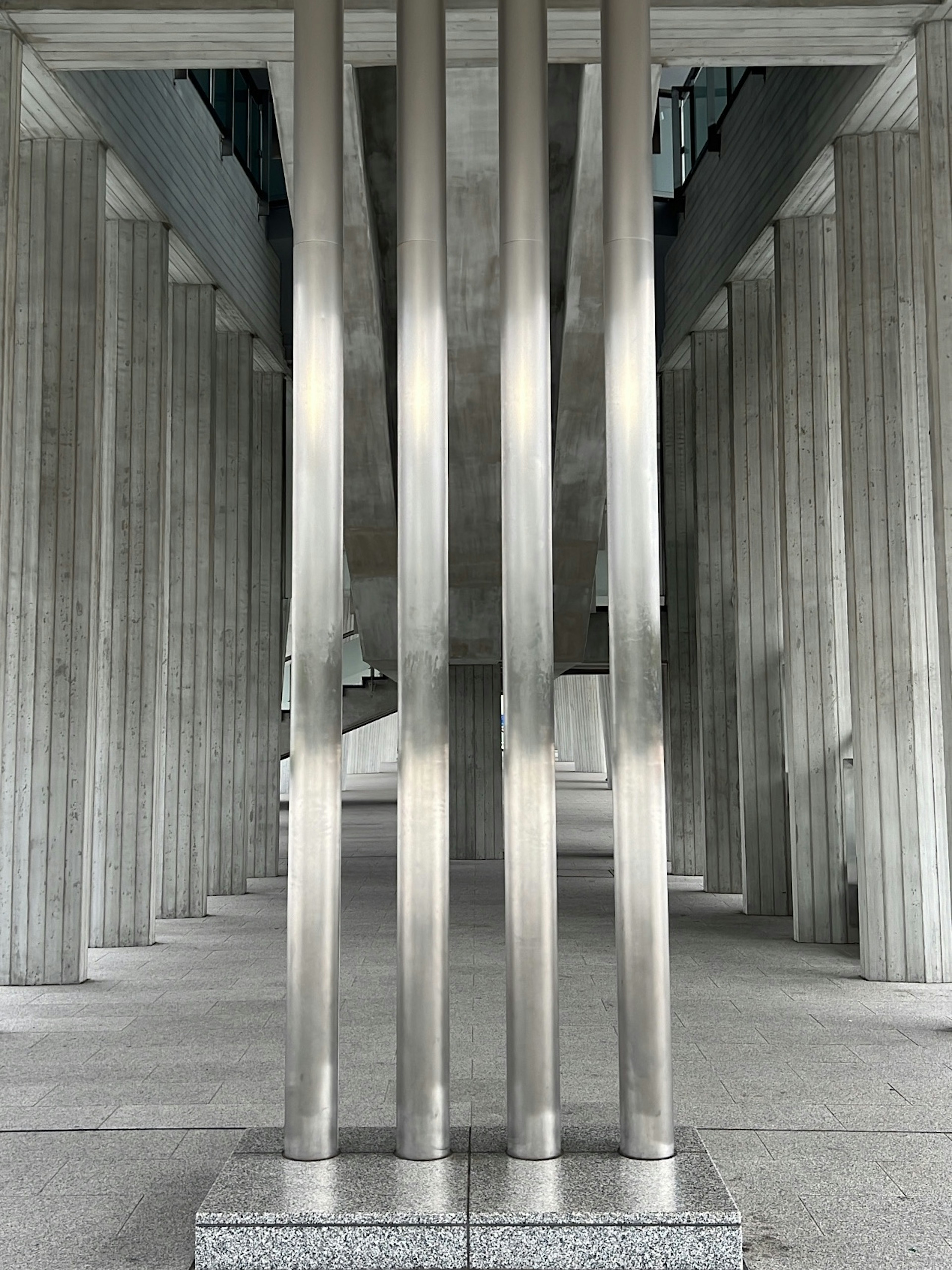 Interior view of a building featuring metallic columns