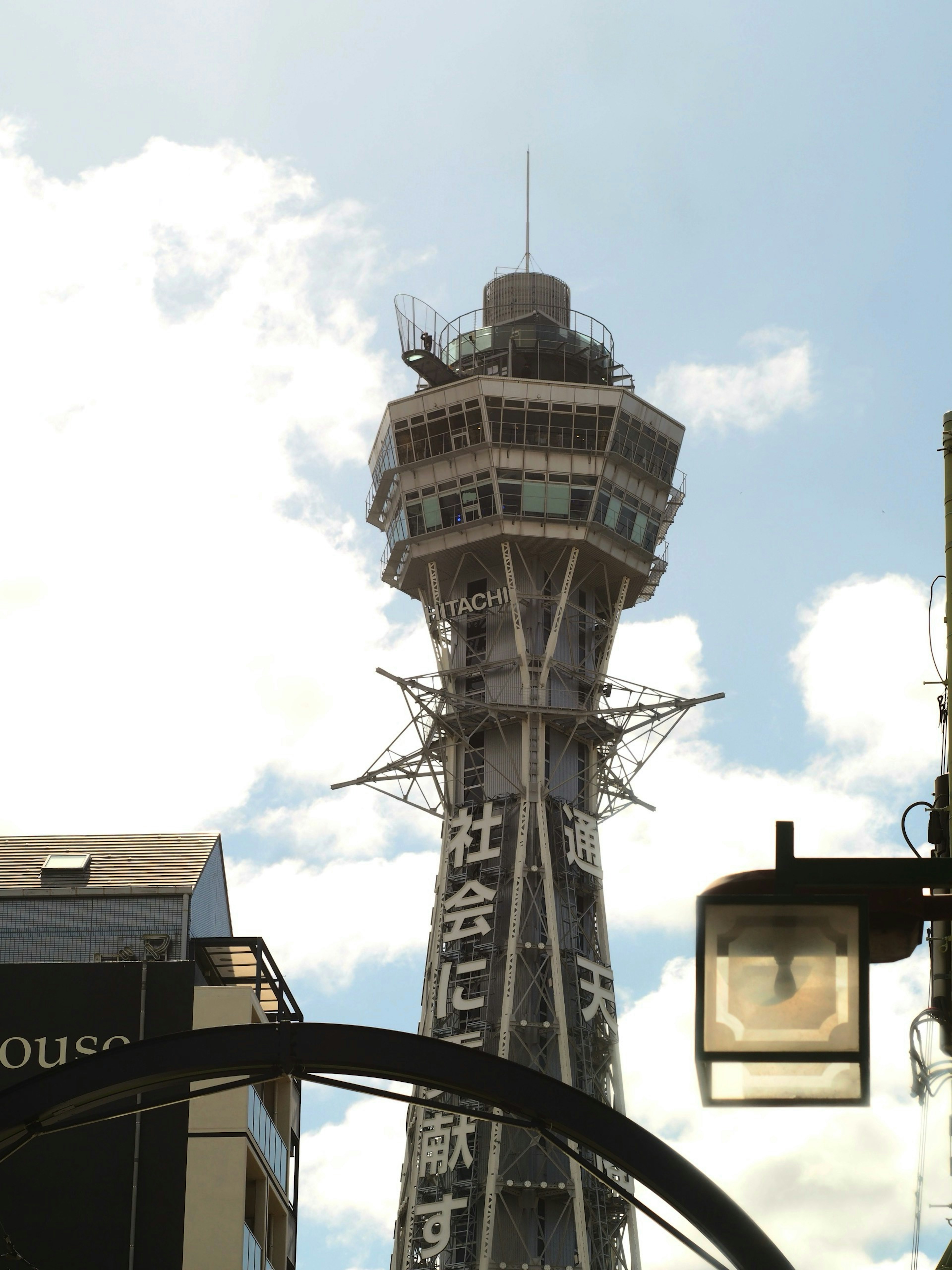 Tsutenkaku Tower in Shinsekai against a blue sky