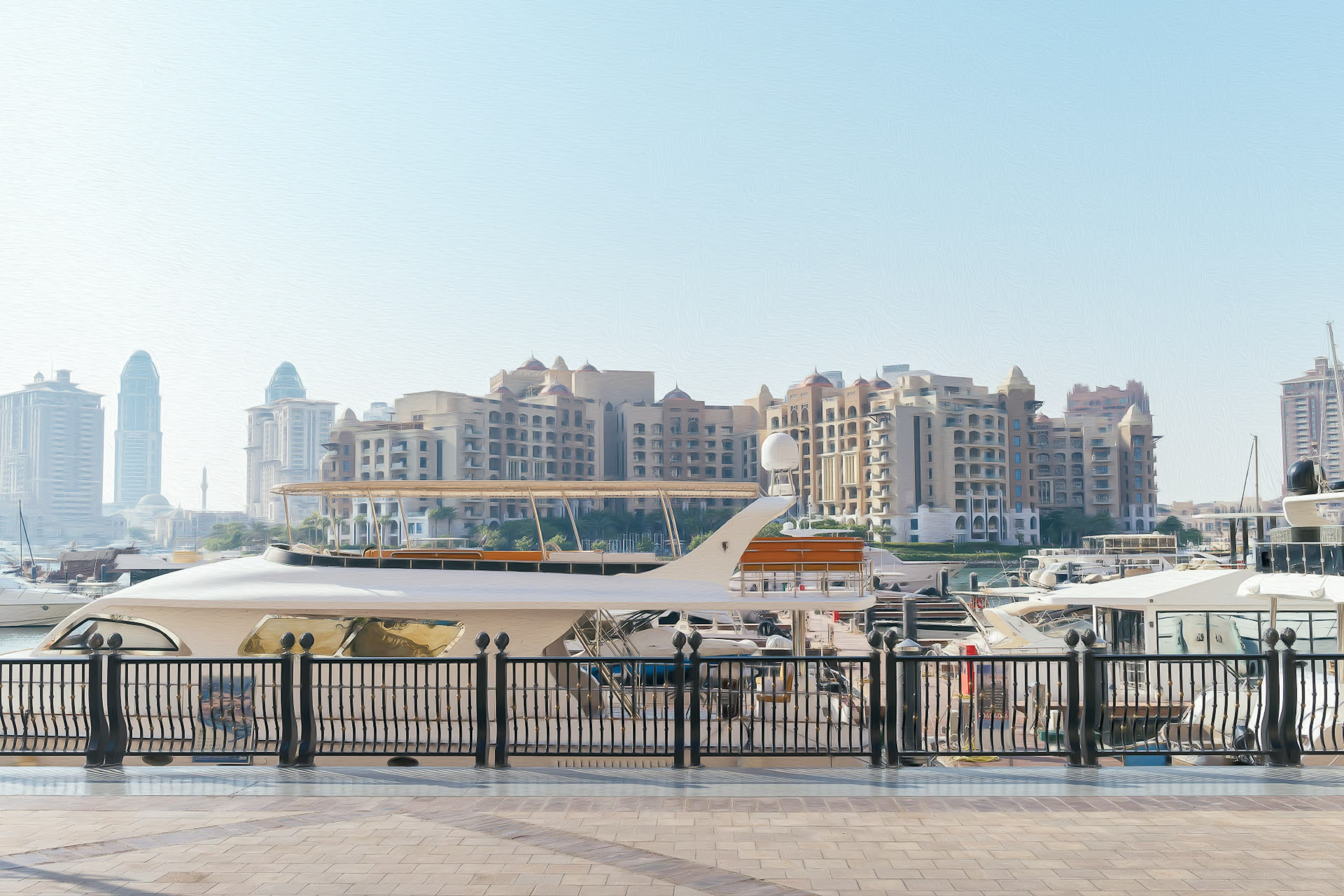 Luxury yacht docked along the coast with a skyline of high-rise buildings