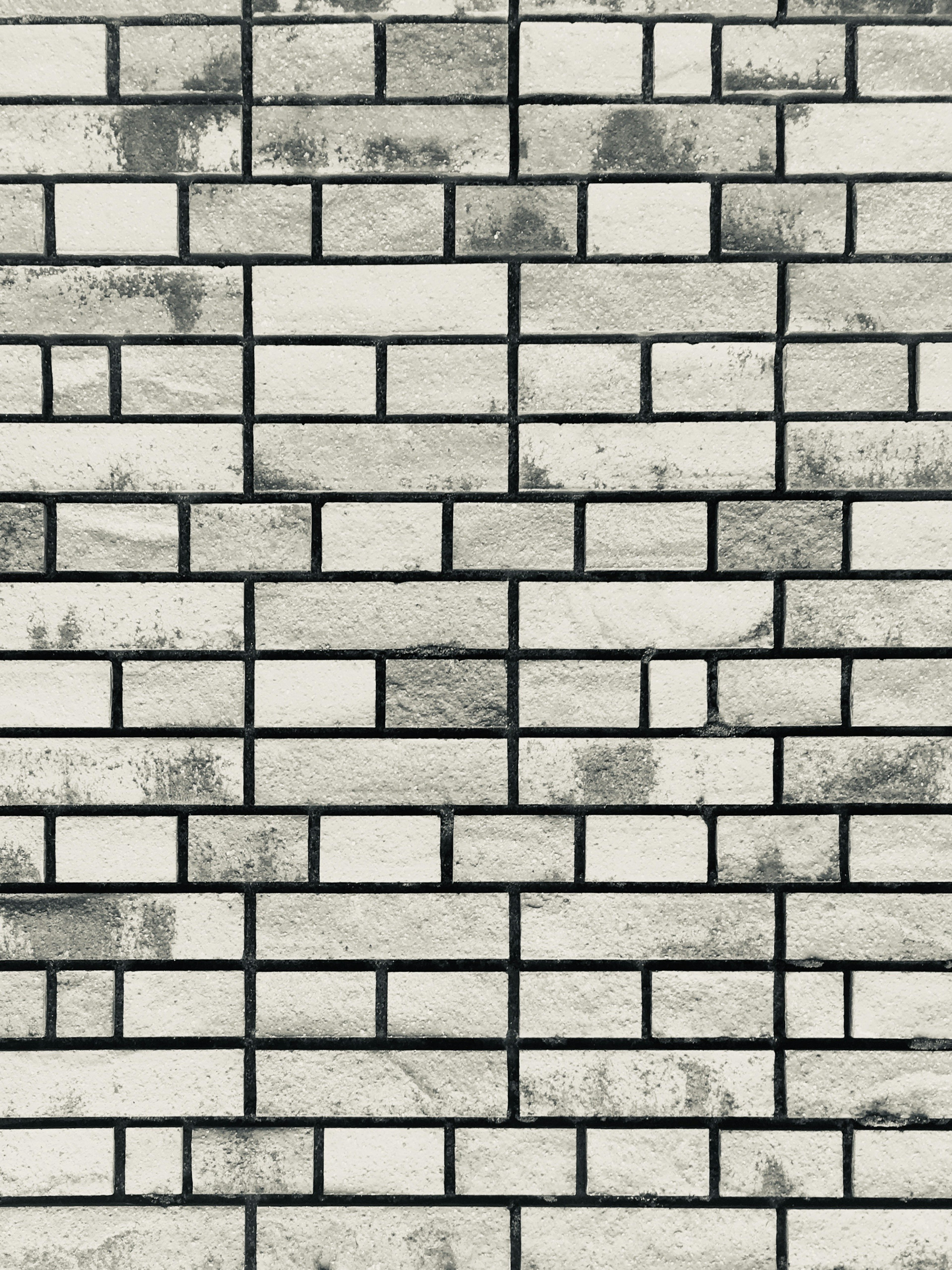 Pattern of black and white brick wall Various sizes of bricks arranged randomly