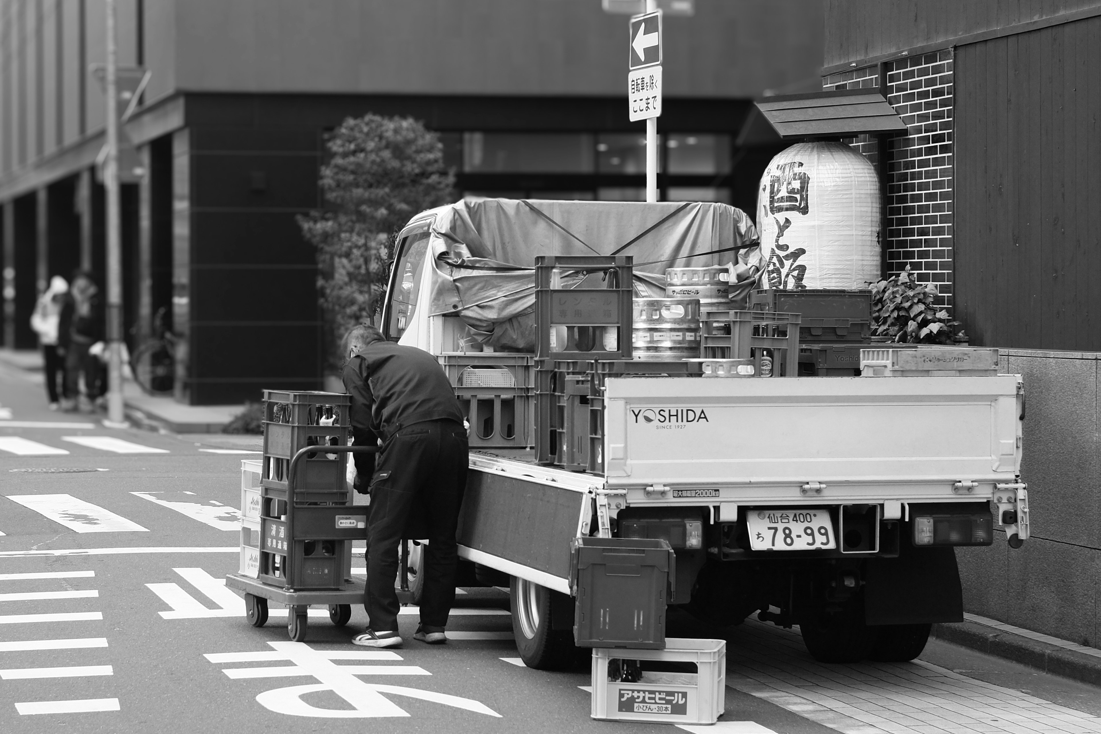 Delivery truck unloading goods on a city street