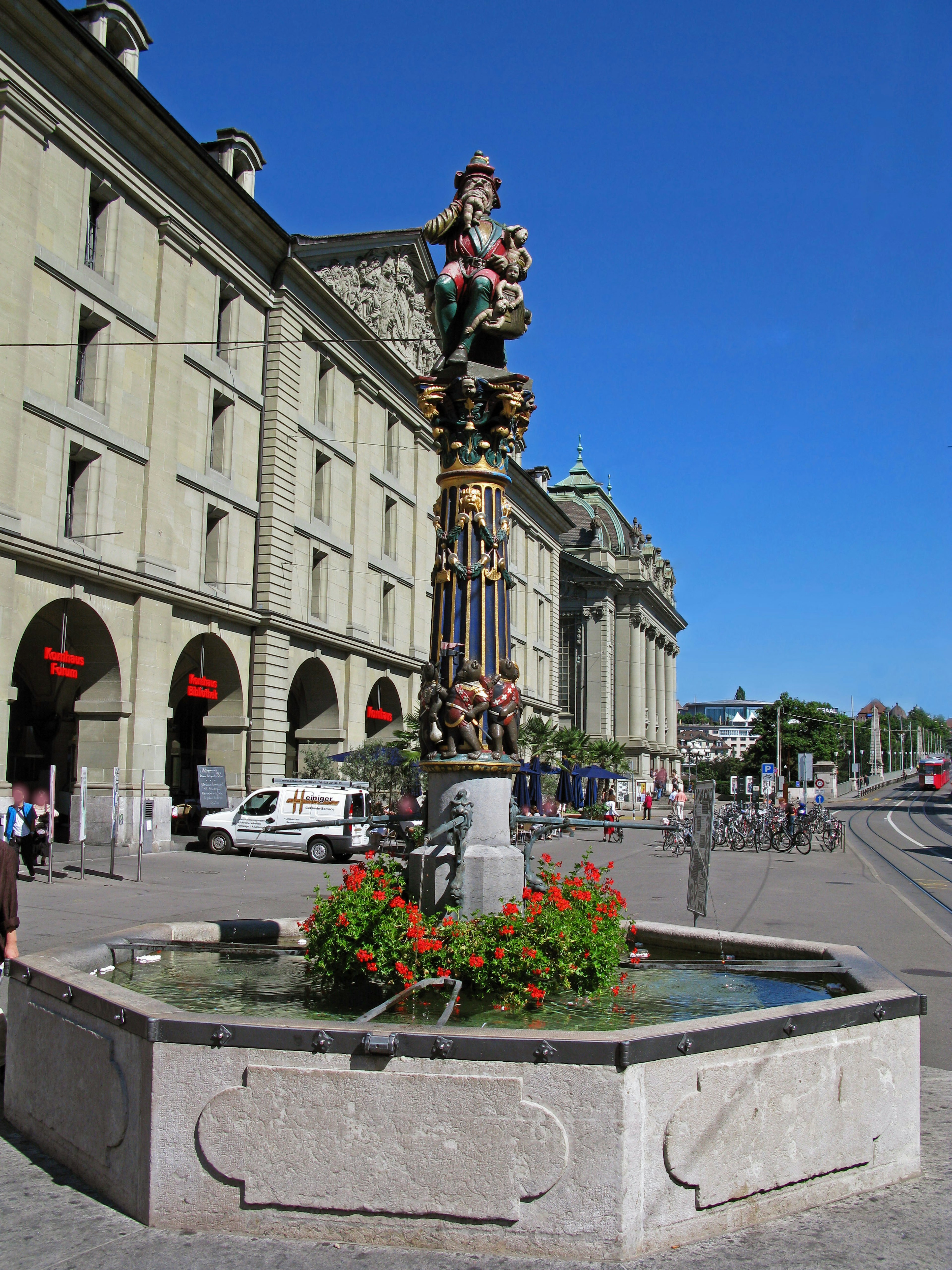 A beautiful fountain with historical buildings lining the street