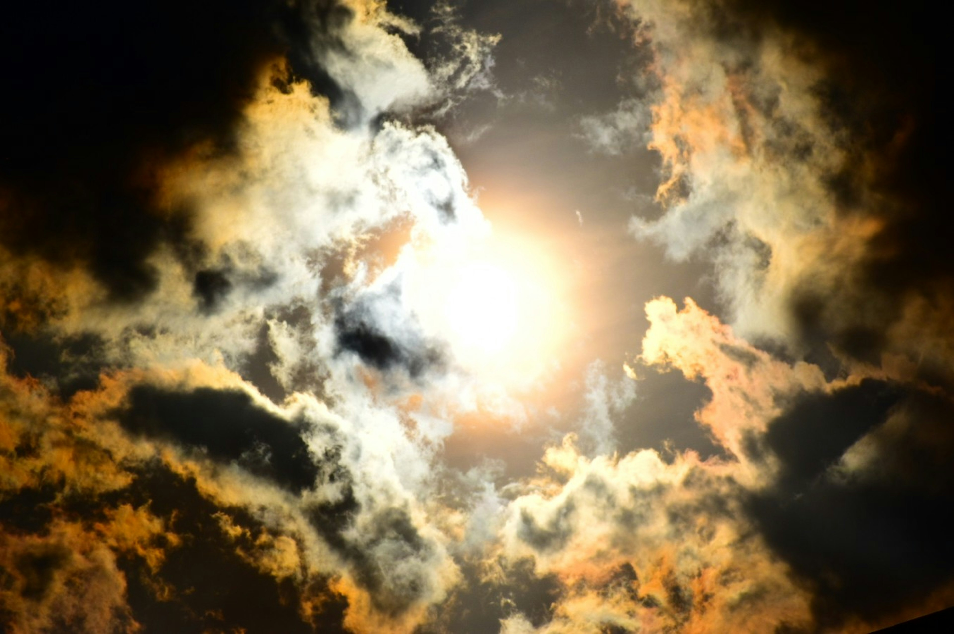 Bright sunlight shining through dramatic clouds