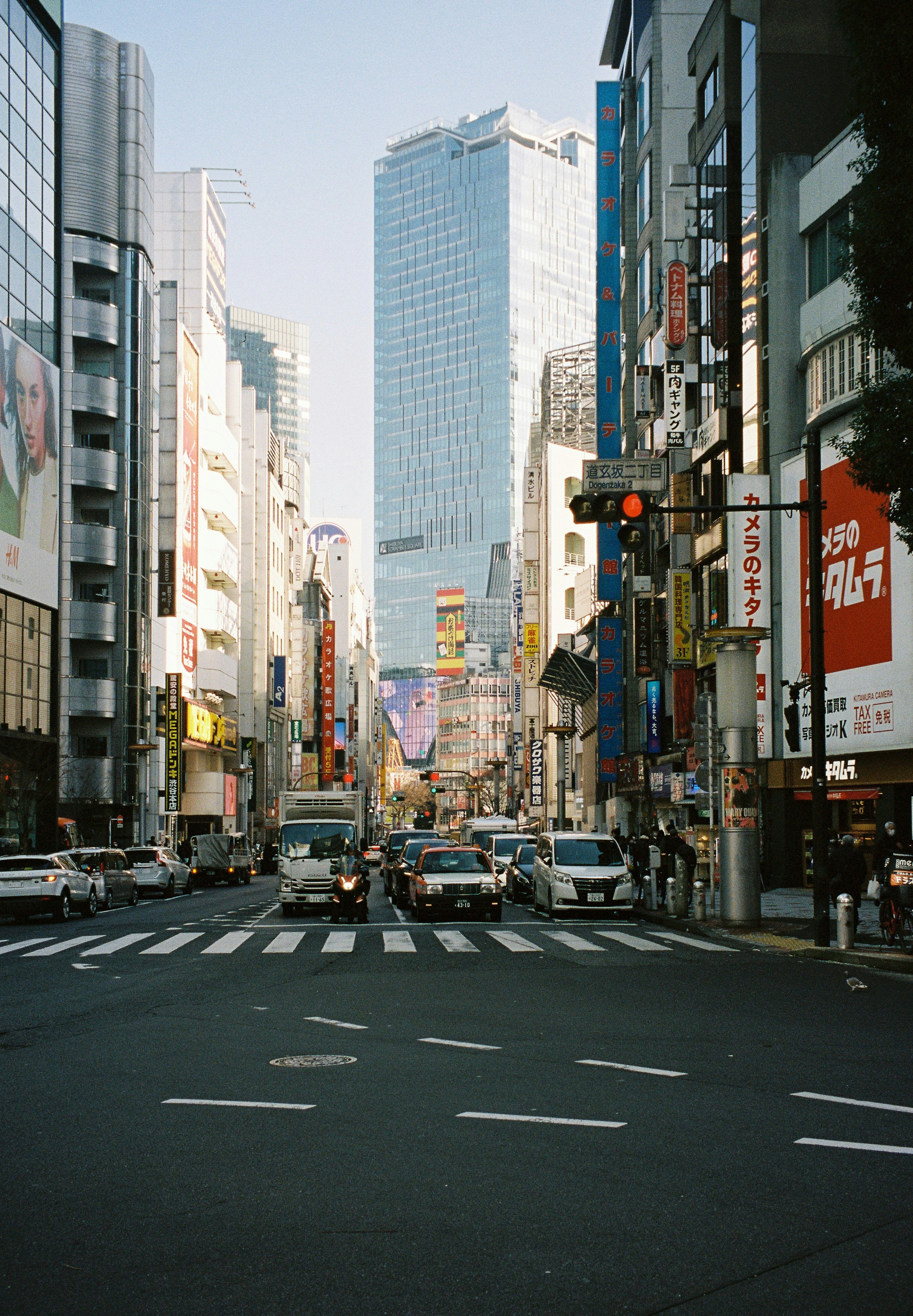 Urban intersection with skyscrapers and traffic lights