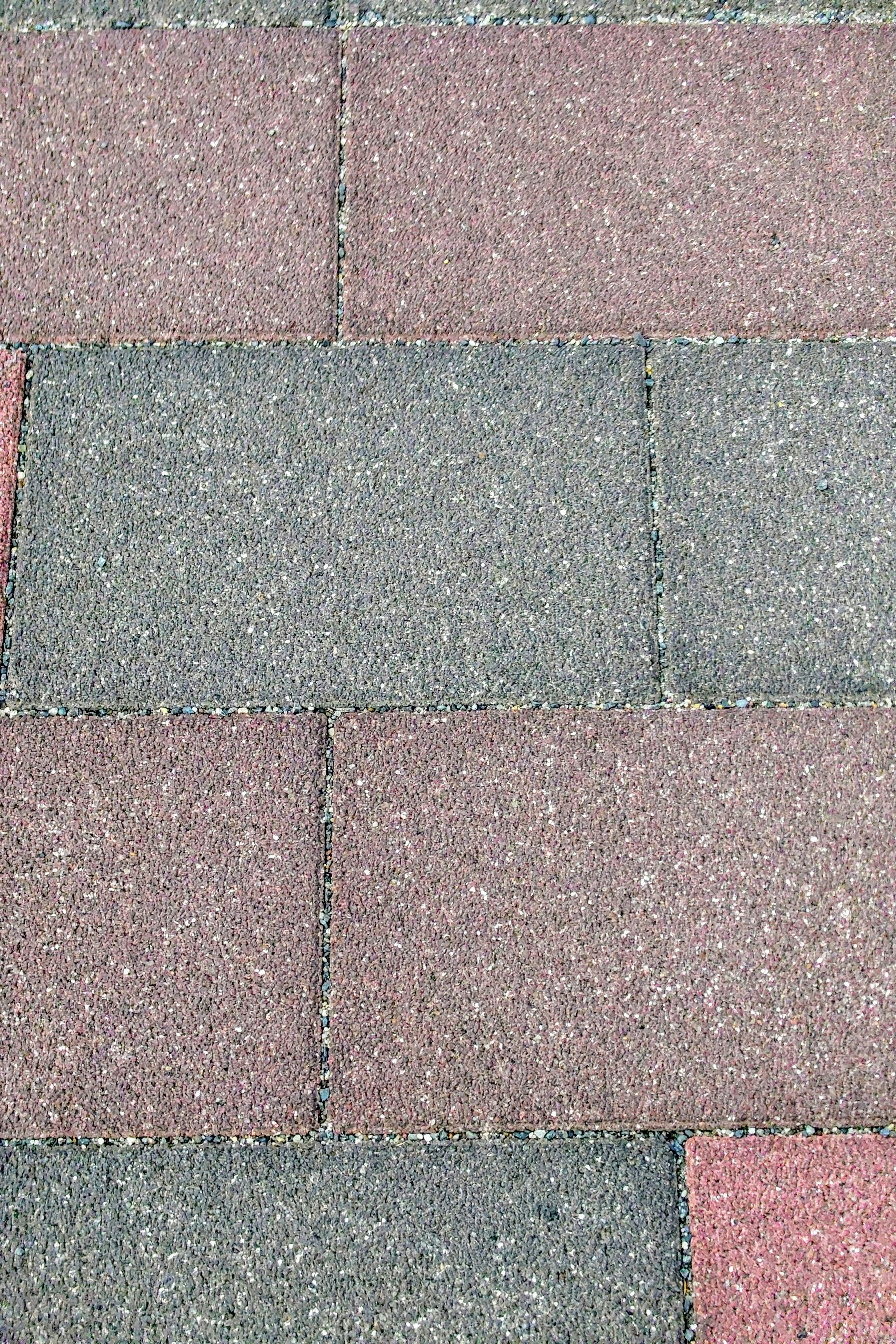 Pattern of colored paving tiles with varying shades