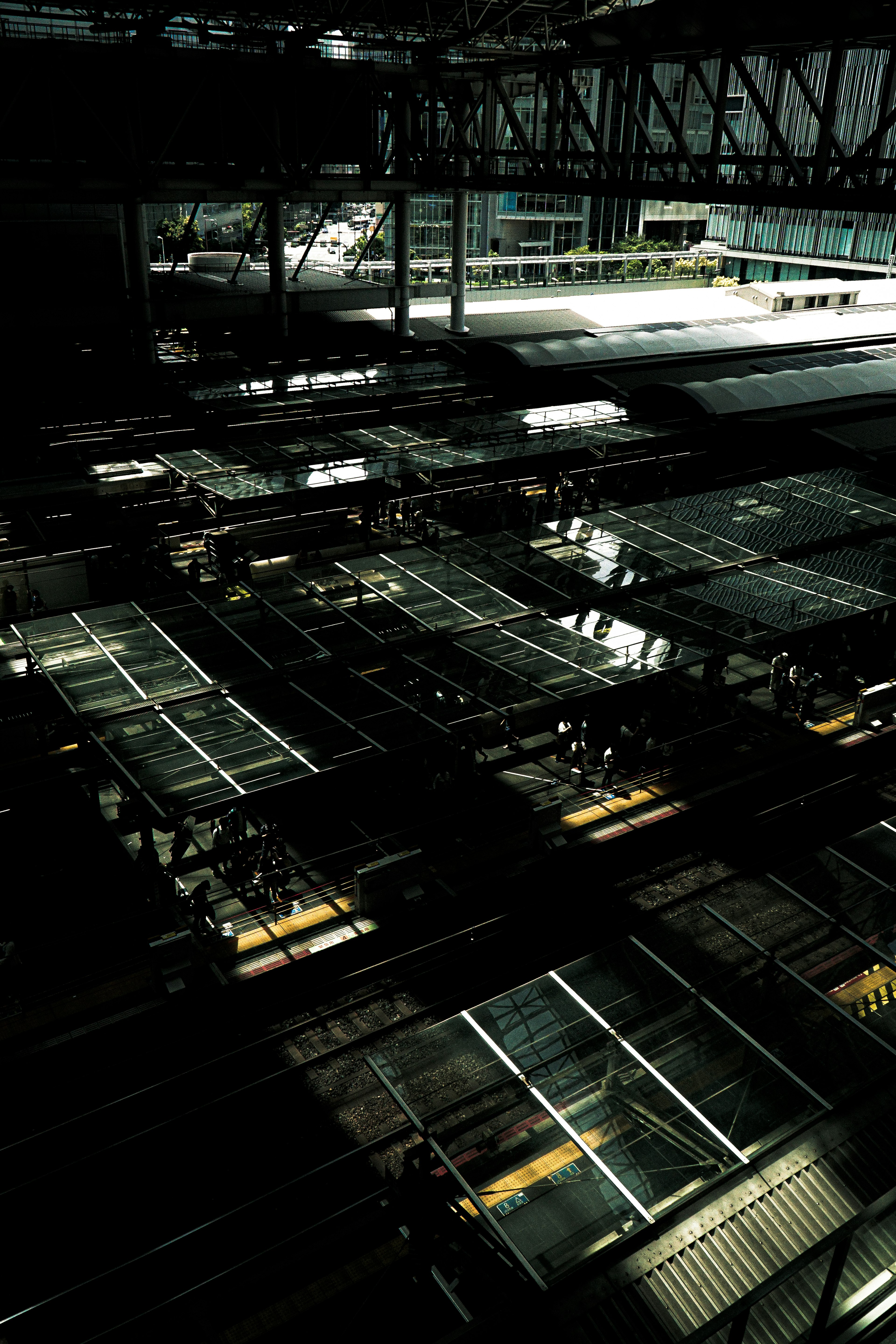 Intersecting steel structures and shadows on a factory roof